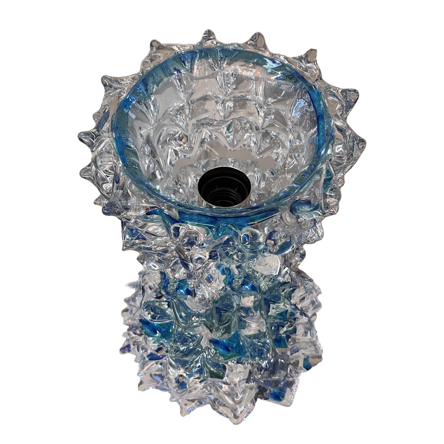 The Rostrato style, characterized by its unique textures and forms resembling a rostrum or beak, was developed by Ercole Barovier in the late 1930’s and remains a popular style, to this day. Although synonymous with Barovier and Toso, the Rostrato