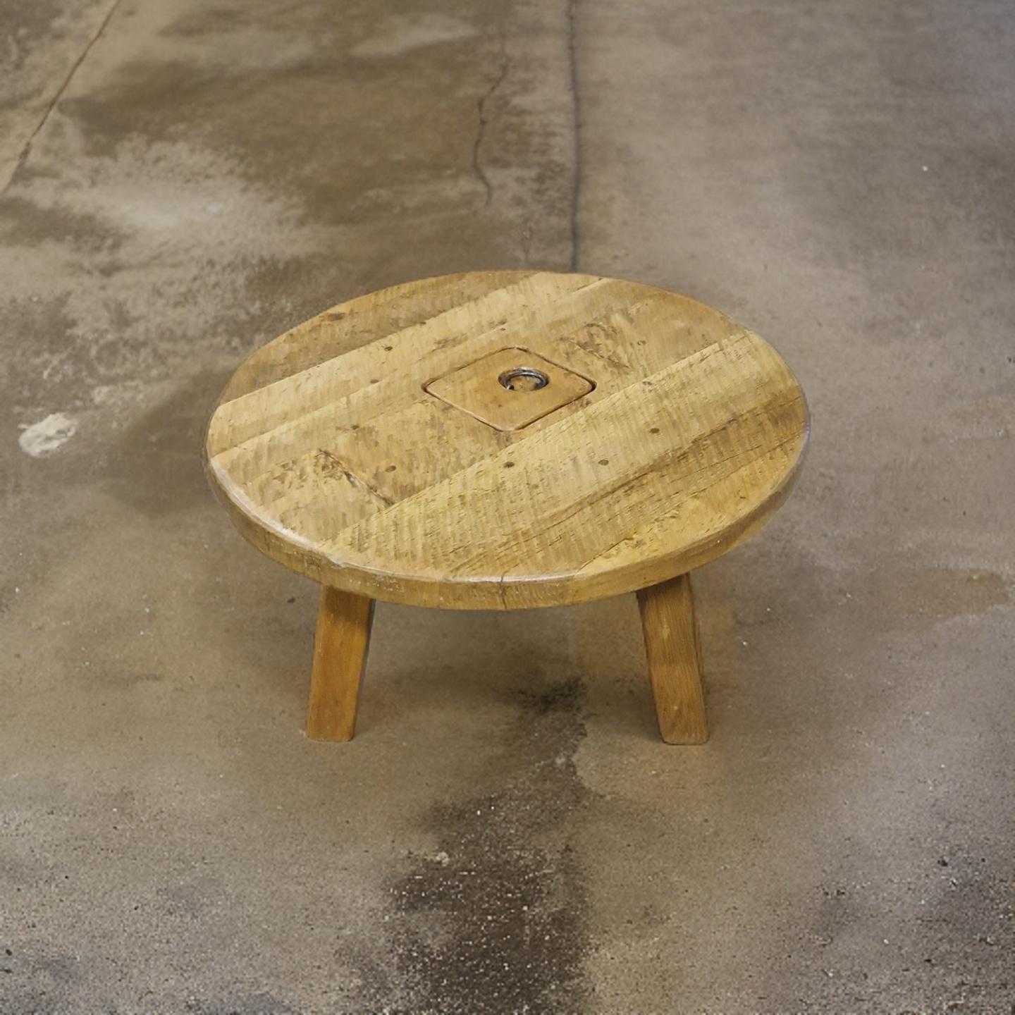 Round brutalist wabi sabi coffee table. Hand made from solid oak. It has a thick circular top standing on 4 solid oak legs. There is a storage space in the middle with a lid and a wrought iron handle. The table measures 100cm in diameter. 

Natural