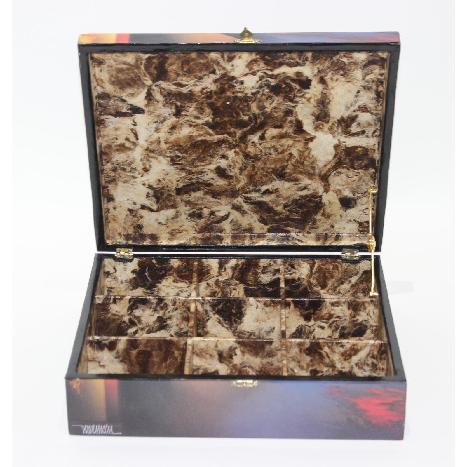 This stylish artisan created storage box dates to the 1990s and was created in a limited edition (23/200) and is fabricated in a marbalized paper (on the inside) and printed paper (outside) that has a clear coat of resin. The piece is signed by the