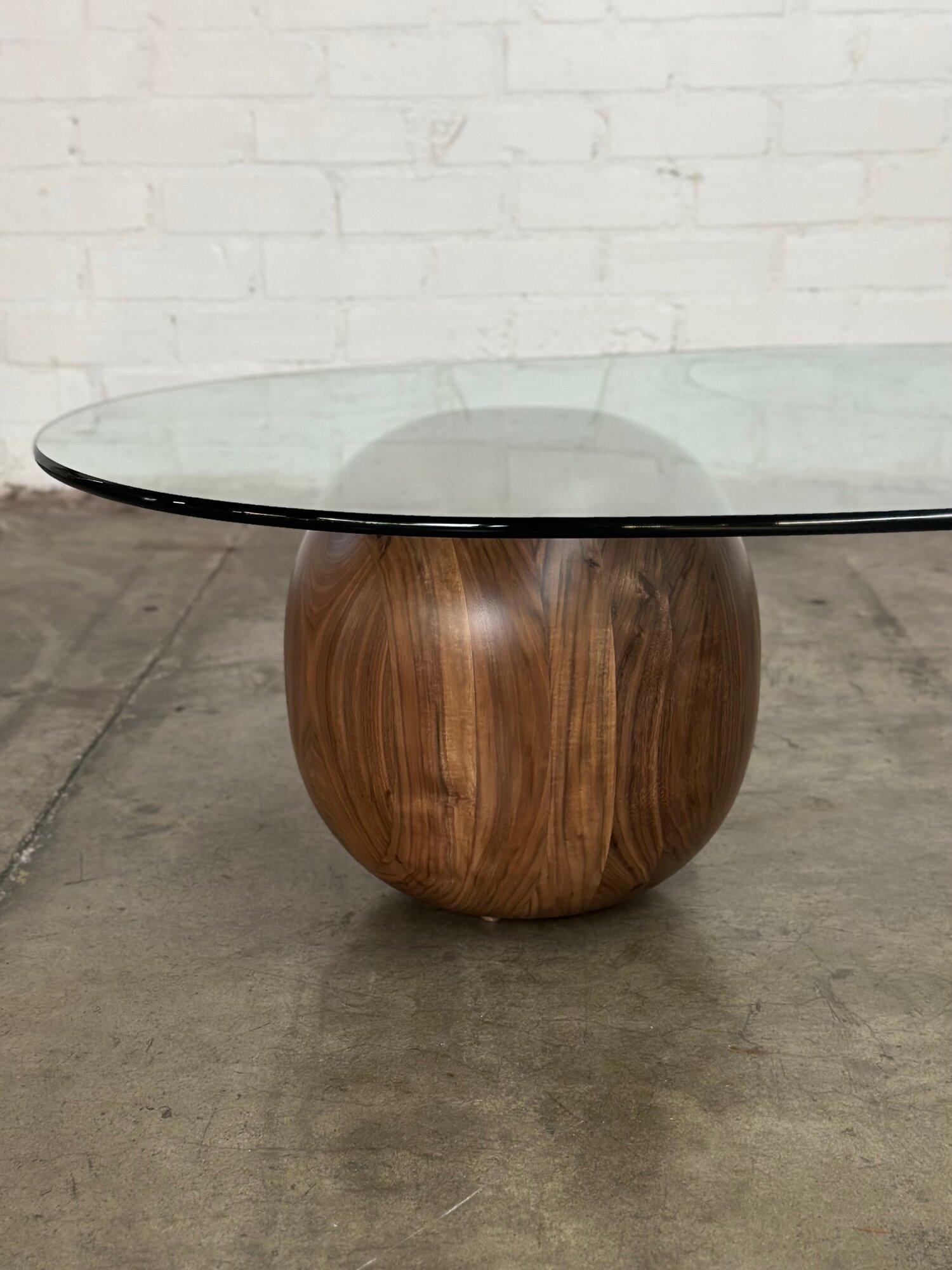 W30 D50 H15.5 
Waterfall coffee table showcasing a heavy solid walnut sphere hand turned in house. Sphere shows well with no visible areas of wear. Natural clear coat shows natural grain and hues. Vintage glass is well preserved with only minor