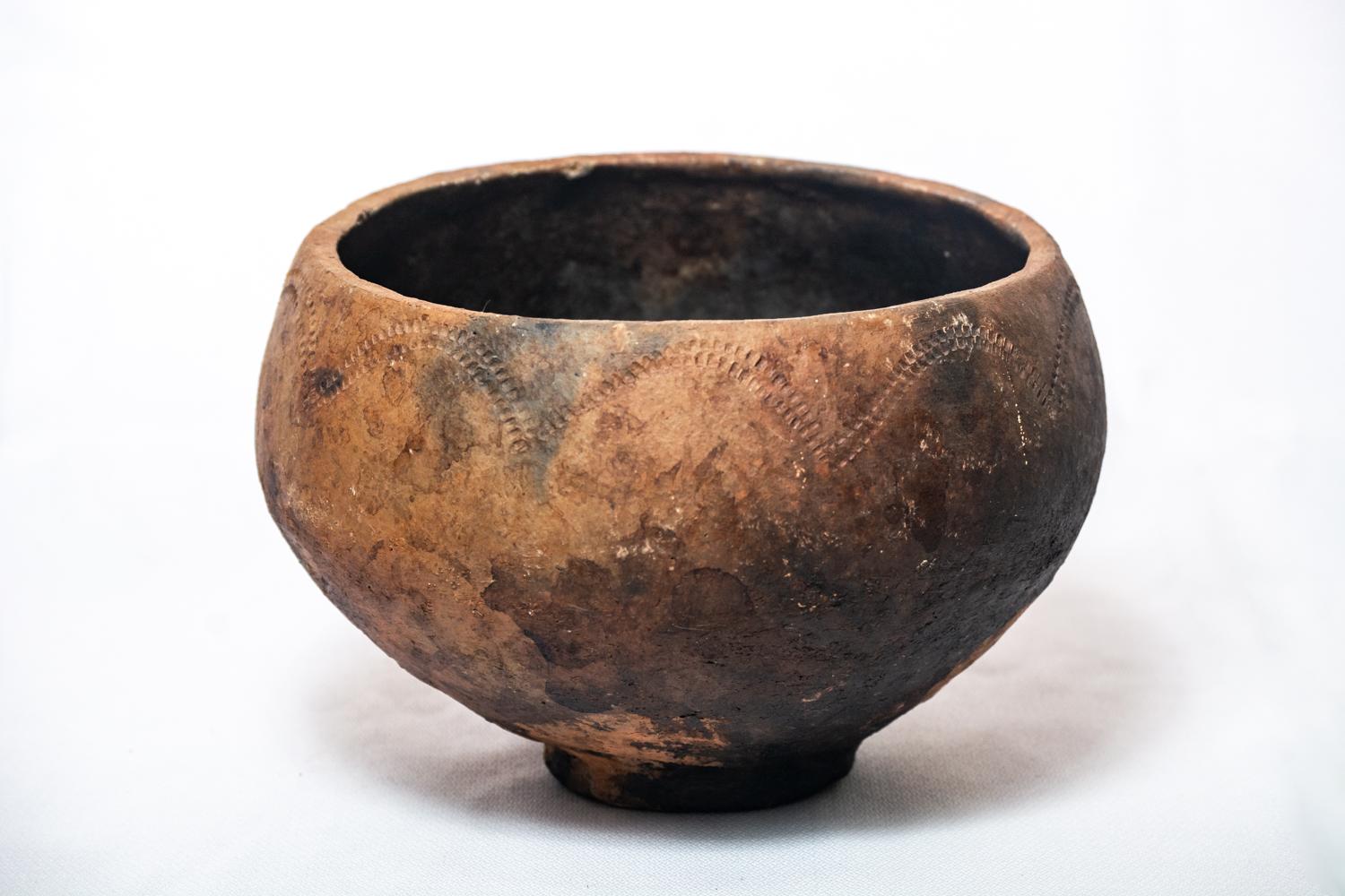 Enhance your living space with the natural elegance of our Handcrafted Local Clay Vase with Wood-Ash Firing. This exquisite vase is made from locally sourced clay and features stunning patterns and textures that are the result of a meticulous