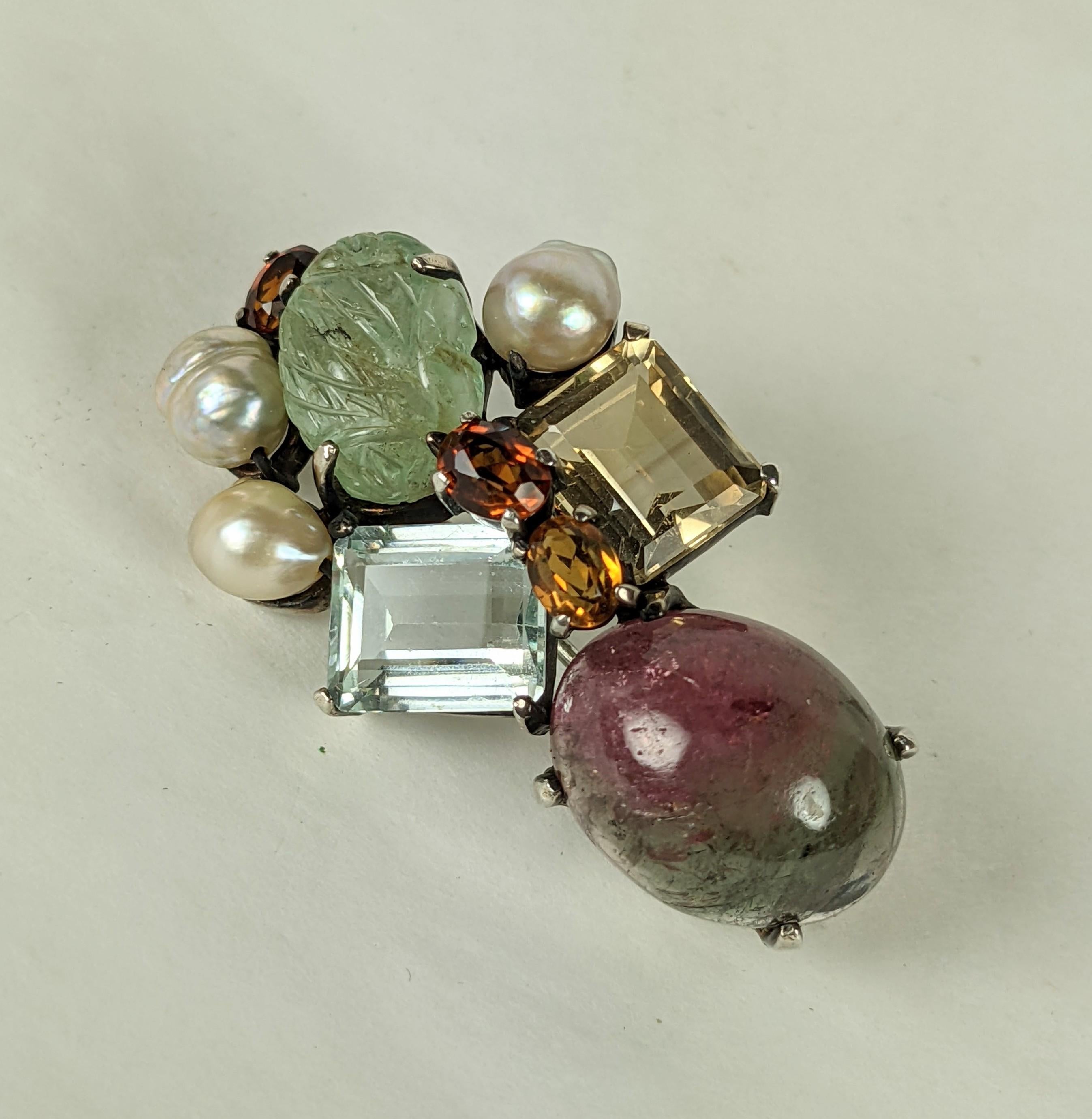 Attractive artisanal Gem Set Brooch from the 1950's set in sterling silver. An unusual combination of watermelon tourmaline, aquamarine, fluorite and citrines with natural pearls. Great play of colors, made from antique elements. 
1950's USA. 2