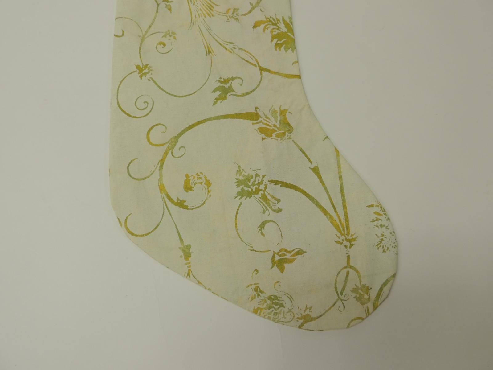 Artisanal holiday gift stocking.
Vintage Fortuny style screen printed in the USA, depicting birds of paradise and vines.
Double-sided, embellished with cotton green ribbon same as hanging hook.
Interlined with cotton fabric. 
Limited edition of
