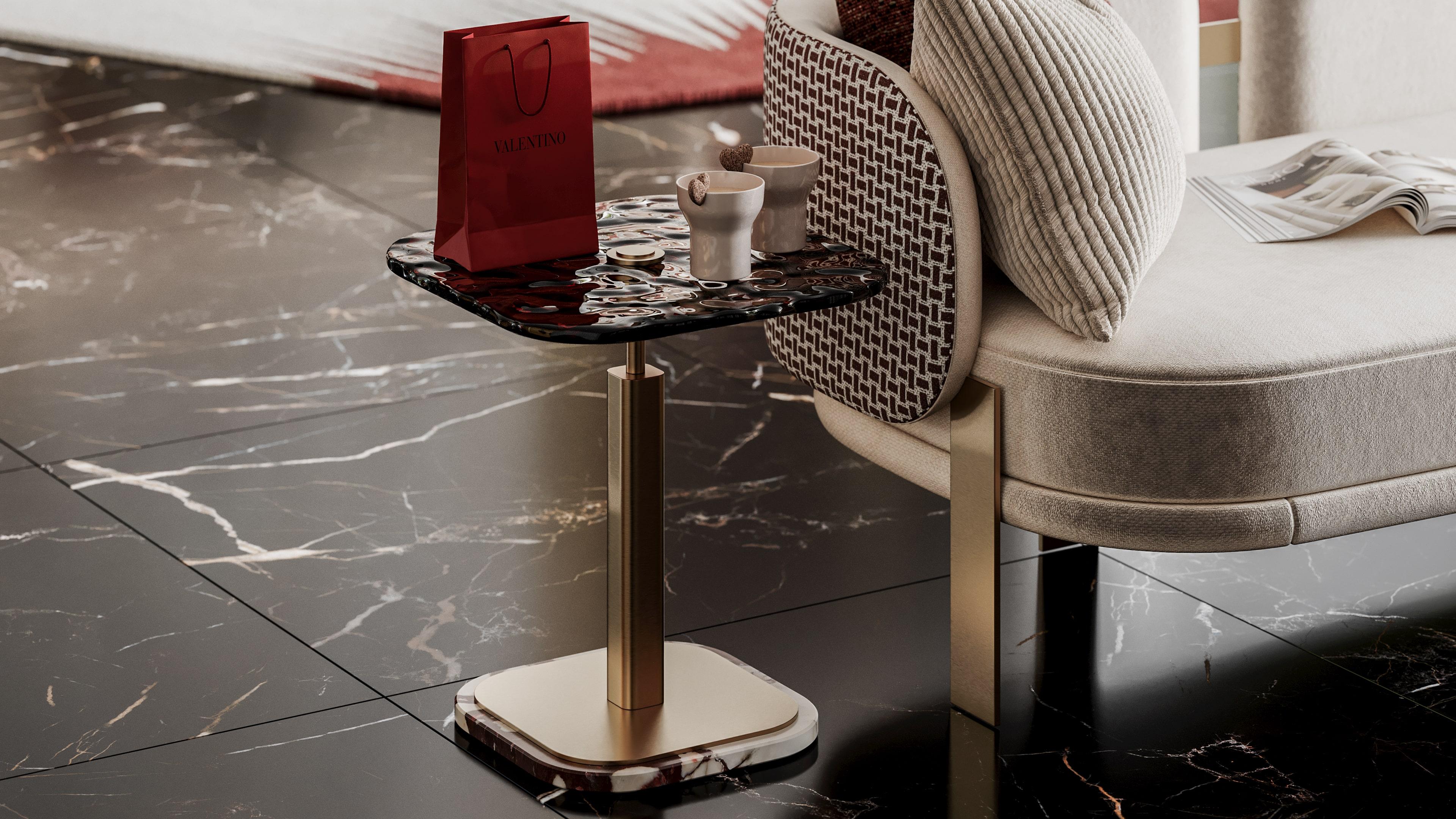 Mejhal is a sleek side table that embodies modern simplicity, featuring a luxurious Calacatta Viola marble base that adds elegance to its design. The piece is enhanced by brass structure and a artisanal glass top. 