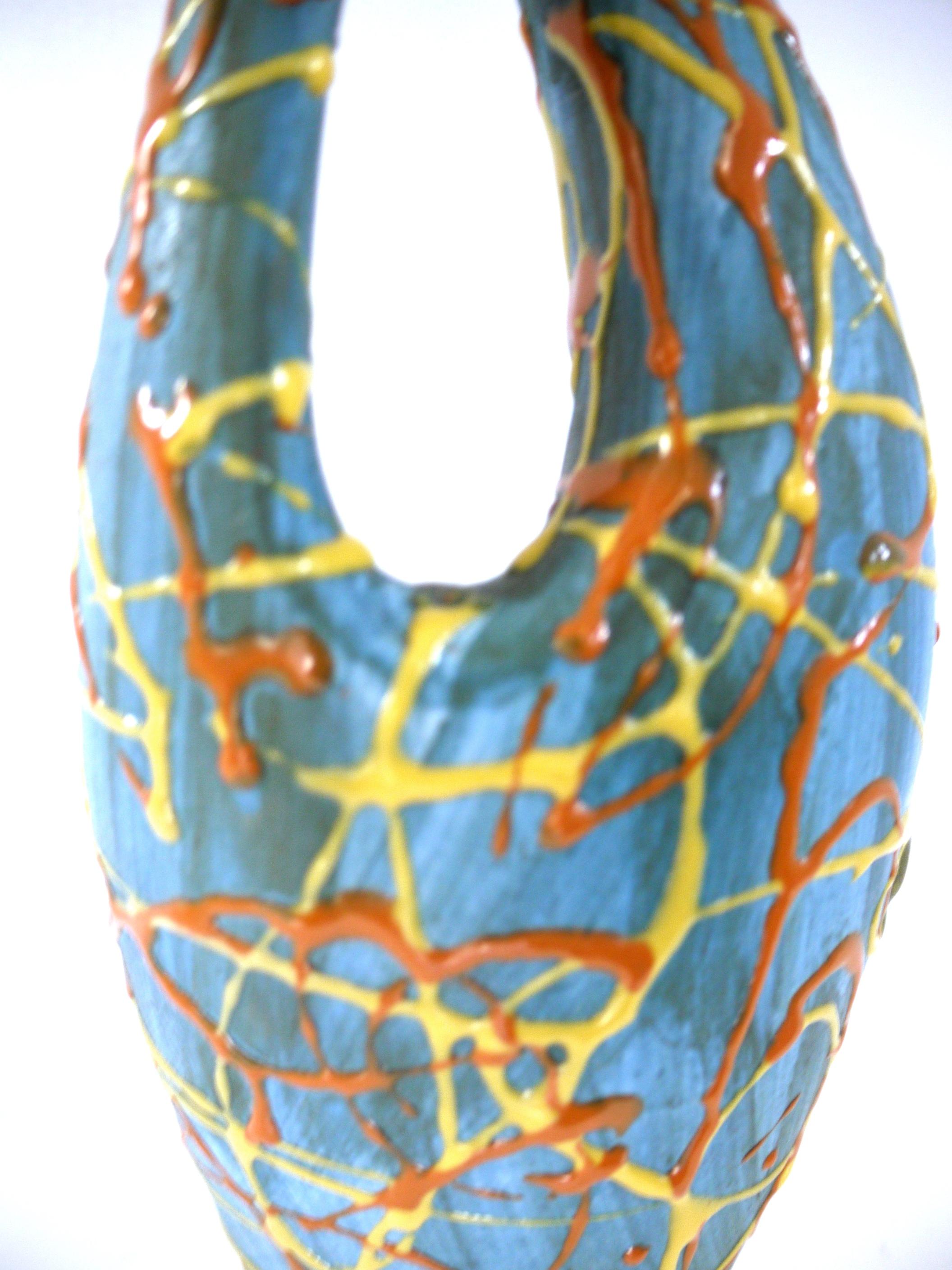 Artisanal modernist French ceramic sculptural vase handmade in the village of Vallauris Cote d'Azur in mid-1960s
Measures: Height 30 cms
Width at widest 12 cms
Diameter at base 7 cms
Stunning color way, dribbled, applied glaze. The base 'wash'