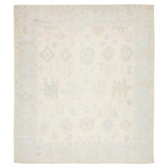 Artisanal Oushak Style Wool Area Rug: Neutral Ivory with Muted Floral Motifs