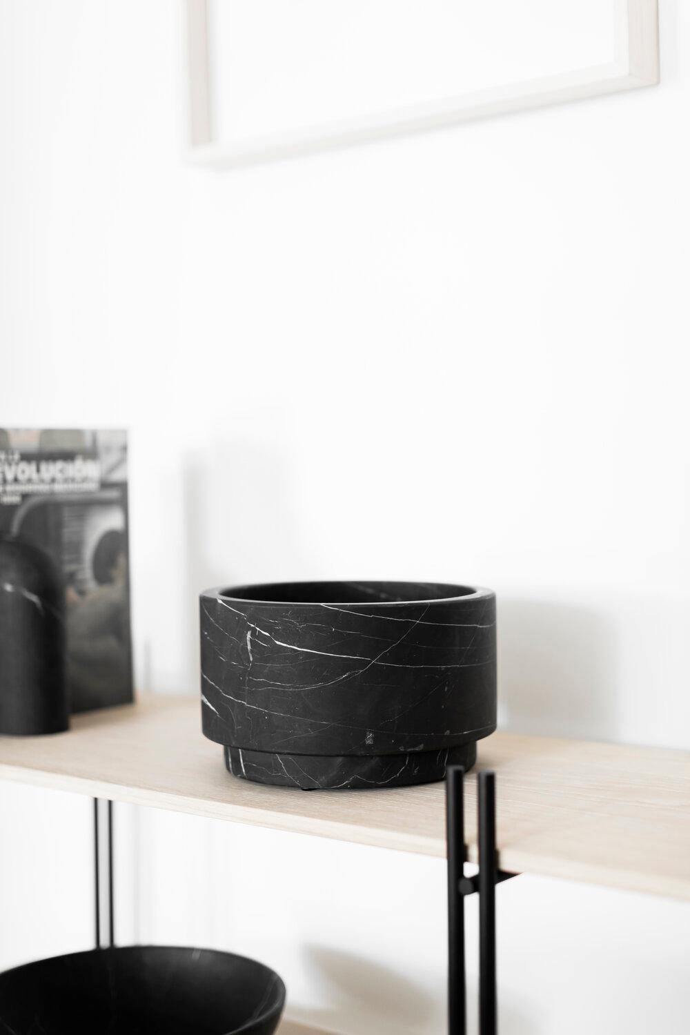 This artisanal home decor vase was hand cut Negro Monterrey black marble from Neuvo Leon, Mexico. Each piece is hand carved by expert artisans and craftsmen following fair trade practices and has a unique veining patterns that makes each piece a