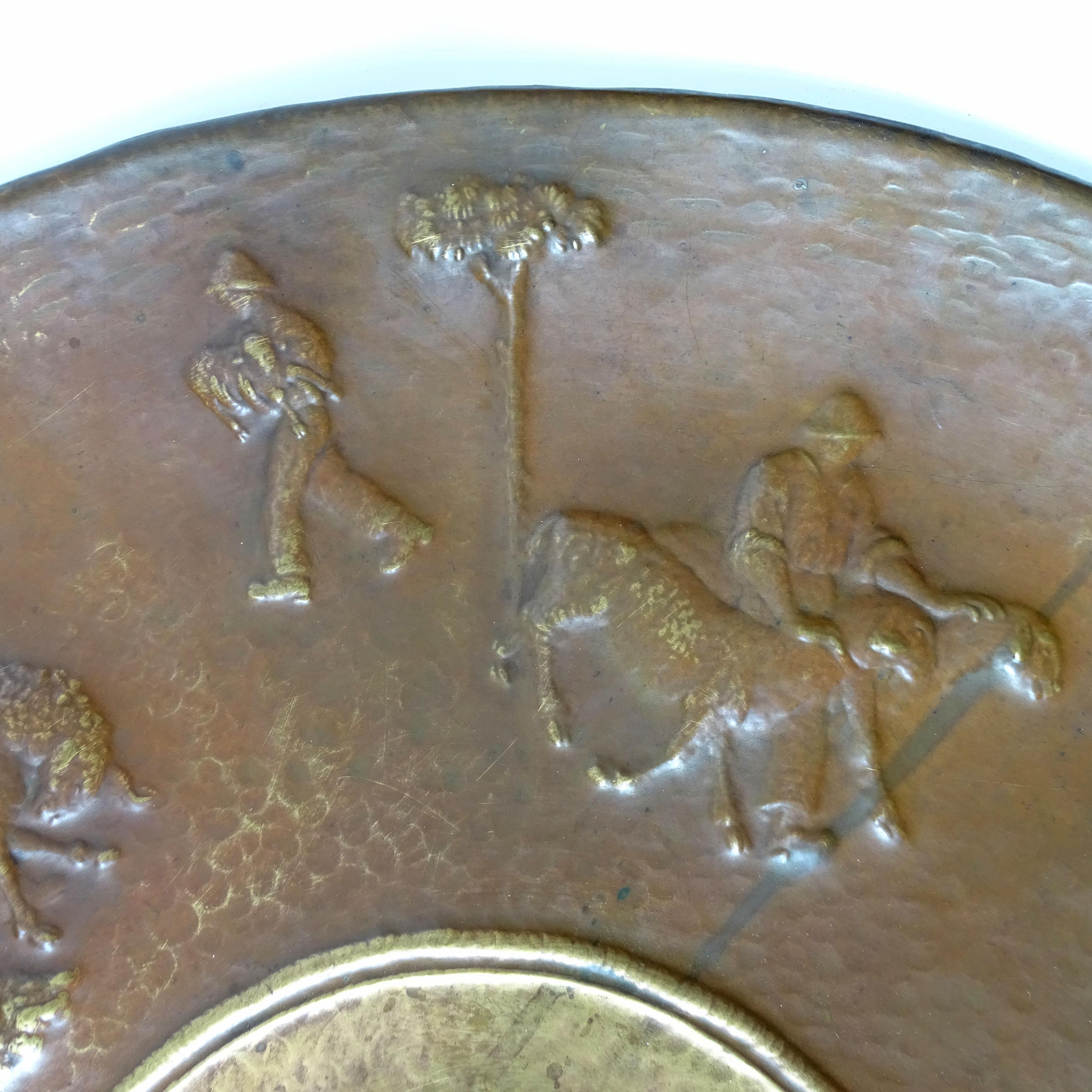 Italian Artist Attilio Nani, Large Embossed Copper Wall Plate with Shepherd theme scenes.
Embossed Signature Tilio Nani.