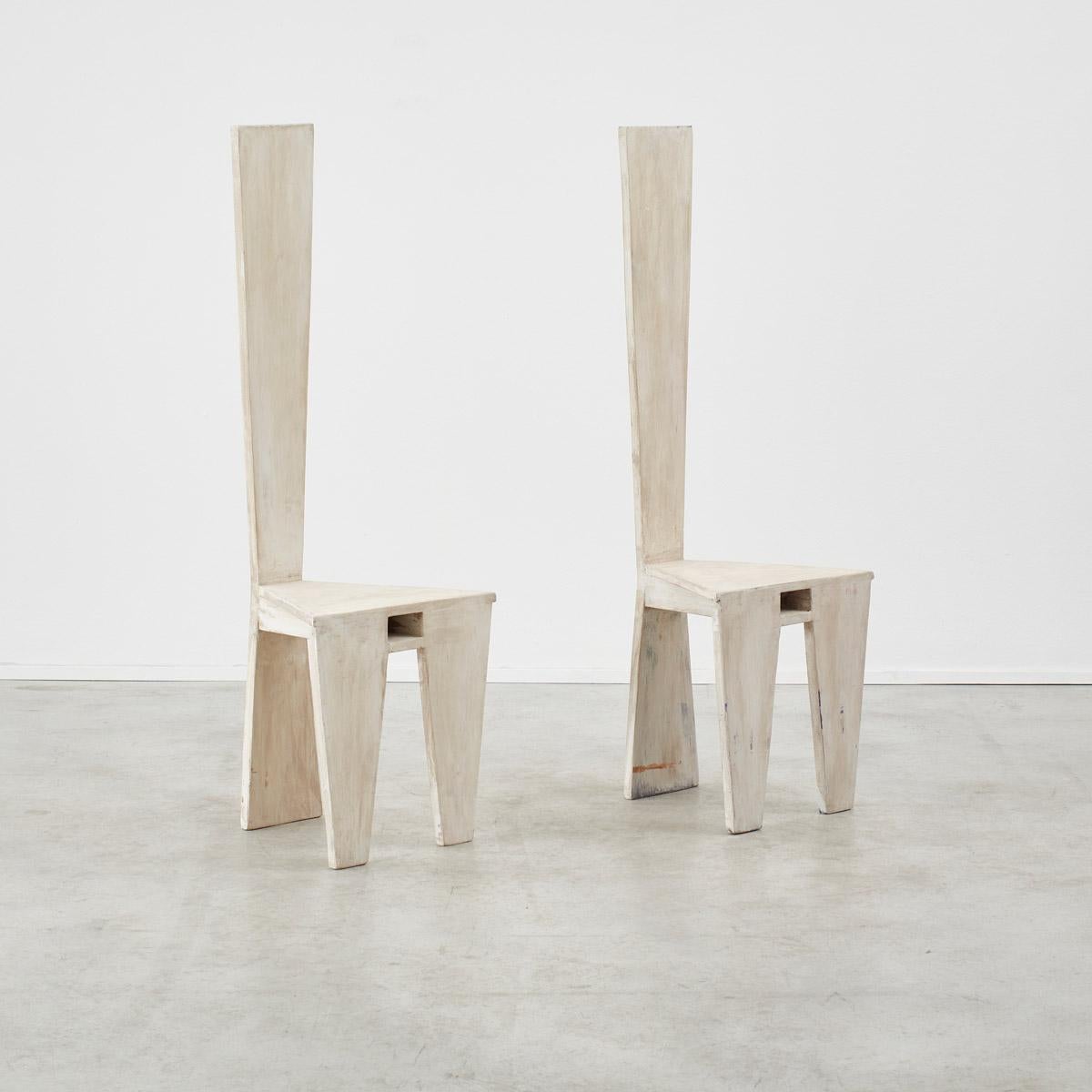 With the poise of an exclamation mark these artist-made wooden sculptural chairs make an architectural statement. Their distressed and chalk-painted surface has bags of lime-washed patina, giving it a weathered look. They’re flexible in their
