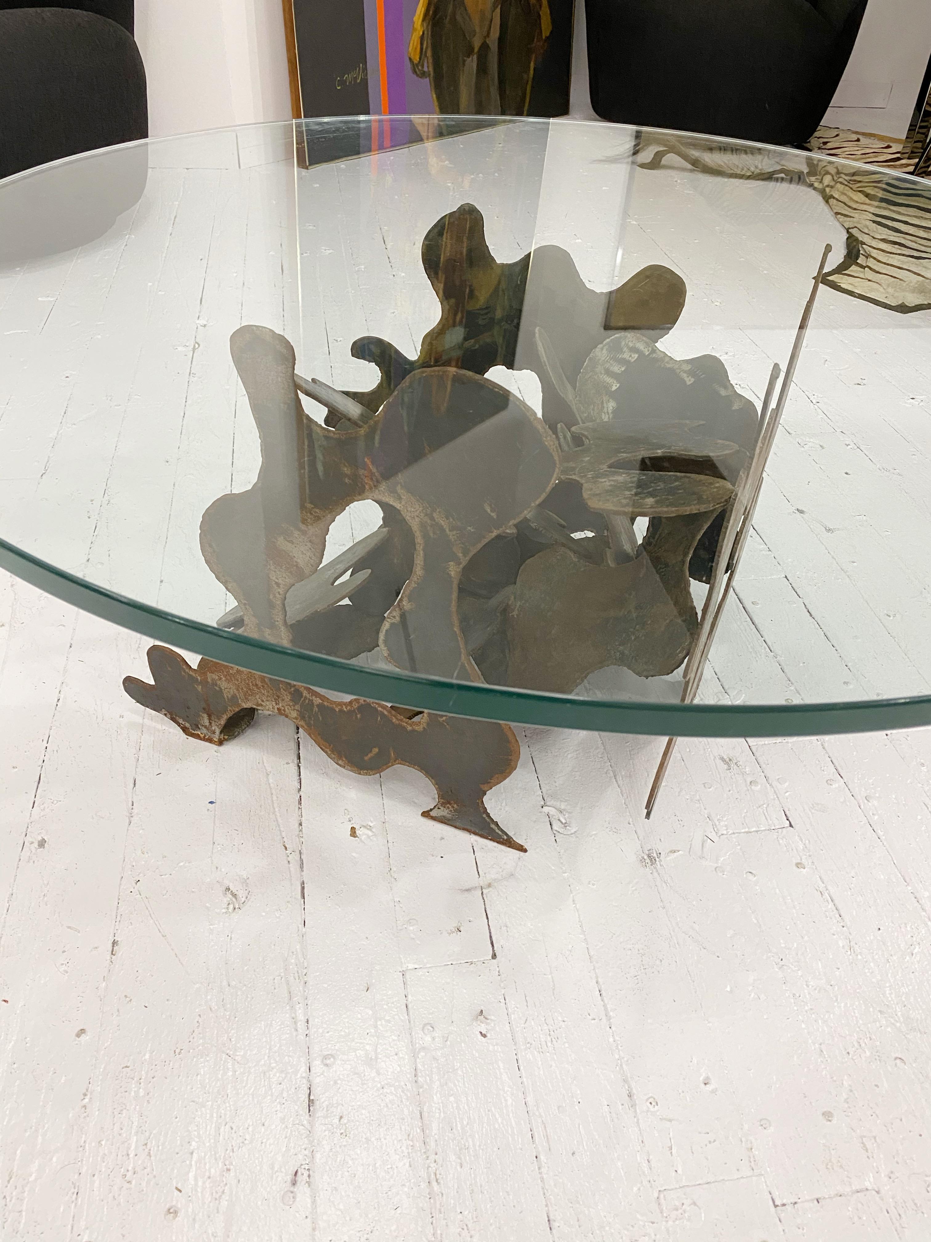 Artist made cut steel coffee table with glass top. In the style of Silas Seandel. Steel pieces cut in a curvy abstract pattern and welded together. Rusted patina.
Base measures: 20” wide 21” deep 17” high
Glass measures: 3/4” thick 41.5” wide