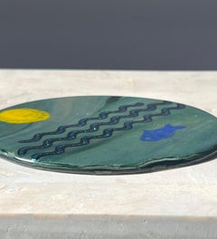 Artist made art glass plaque with fish motif, 20th century.