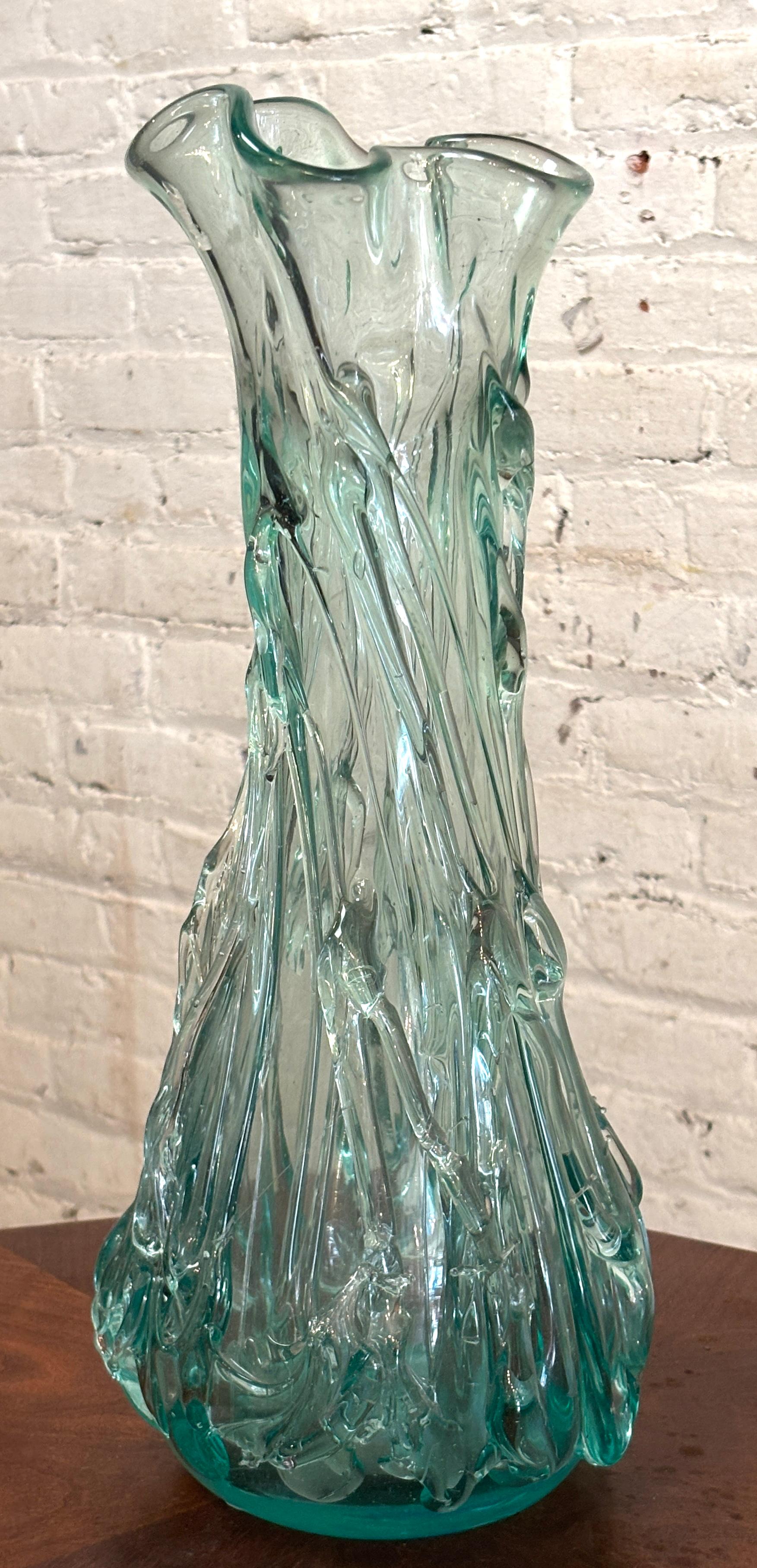 This hand made glass vase has a wonderful textured shape, with a sea green coloring.
Please confirm location NY or NJ