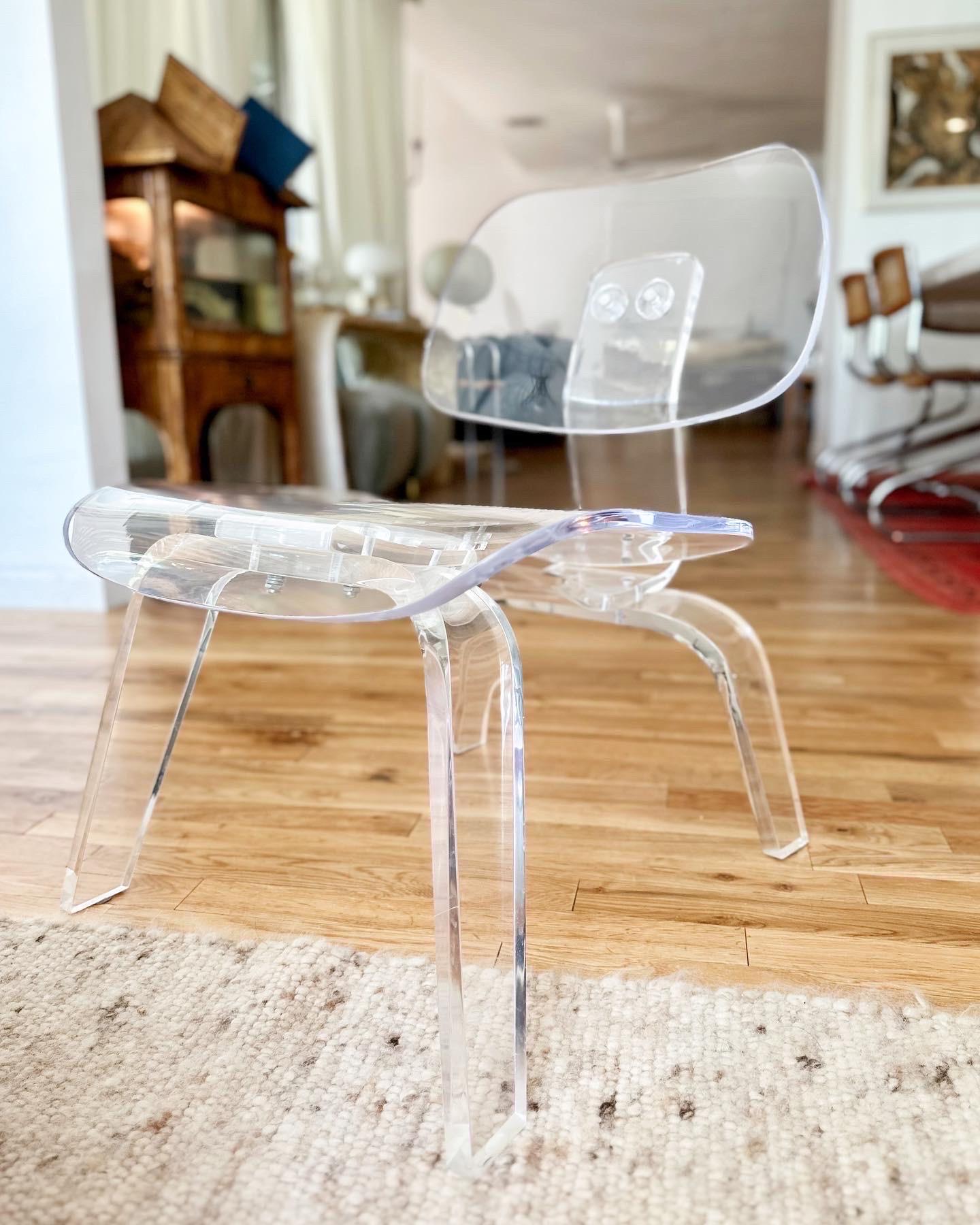 Lucite lounge chair modeled after the iconic Eames LCW plywood chair by Herman Miller, custom-made by acclaimed artist Aaron R. Thomas, c.2000. This rare and collectible piece is a true example of furniture-as-art. Made to order in limited