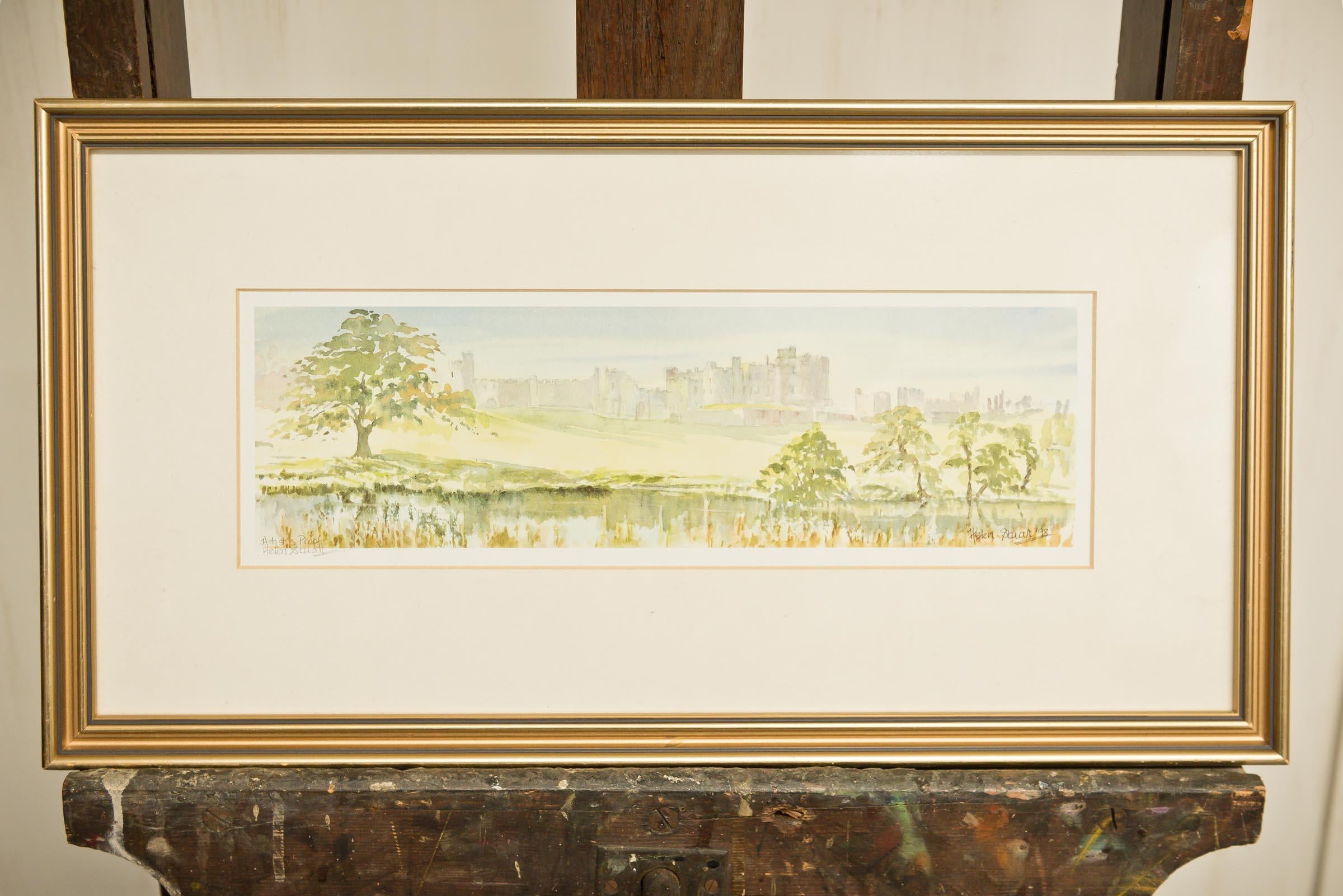 Helen Stuart is a water colour artist who specialises in Northumberland scenes. This signed Artist's Proof of Alnwick Castle is framed and would effortlessly fit in most any space. The soft colours, trees and water gently lead to the hazy castle. A