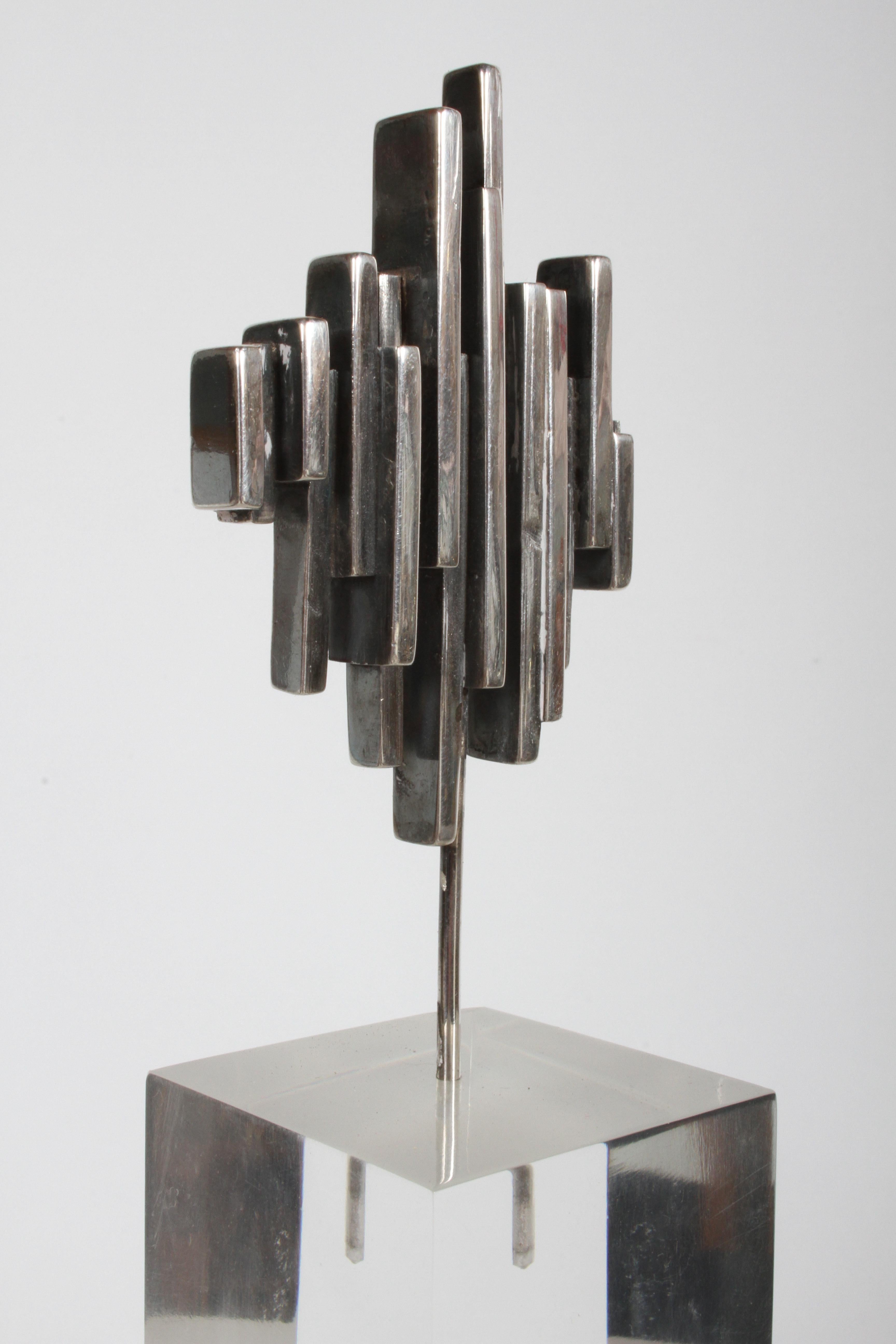 R.W. Smith signed and dated 1971 sterling silver mini abstract sculpture on lucite base. Lucite cube base has one slight blemish to top edge, otherwise nice vintage condition, with light surface scuffs. Lucite base is 4
