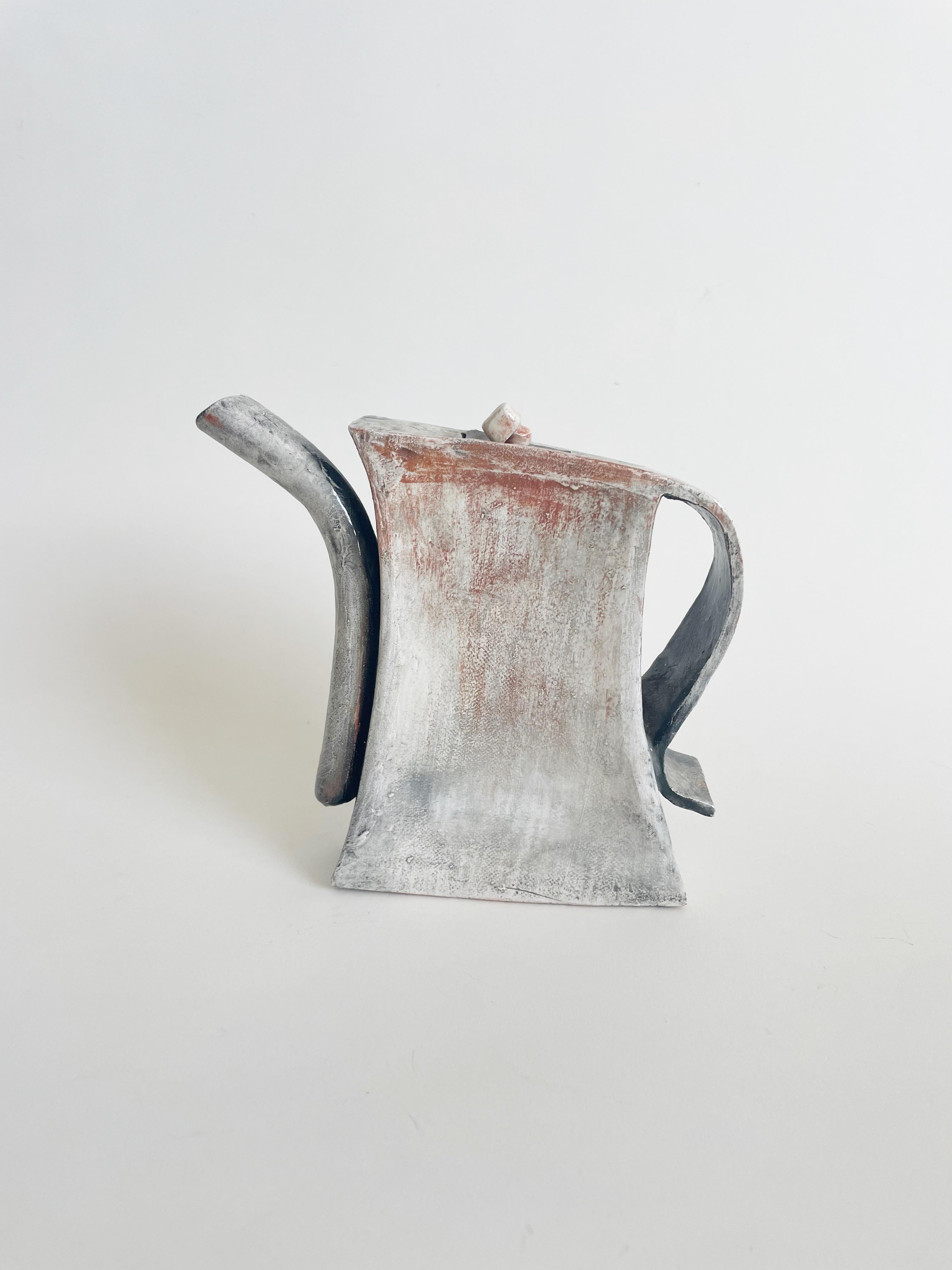 Signed pottery slab teapot with neutral grey and brown glaze. Measures 8