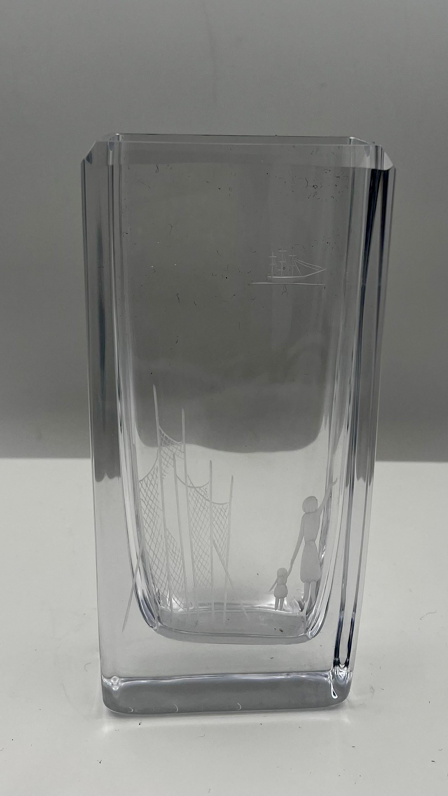 A beautiful signed by crystal Bengt Edenfalk Skruf vase was made in Sweden during the 1970s in a Mid-Century Modern style. excellent condition no chips or cracks, nice etching on both sides.