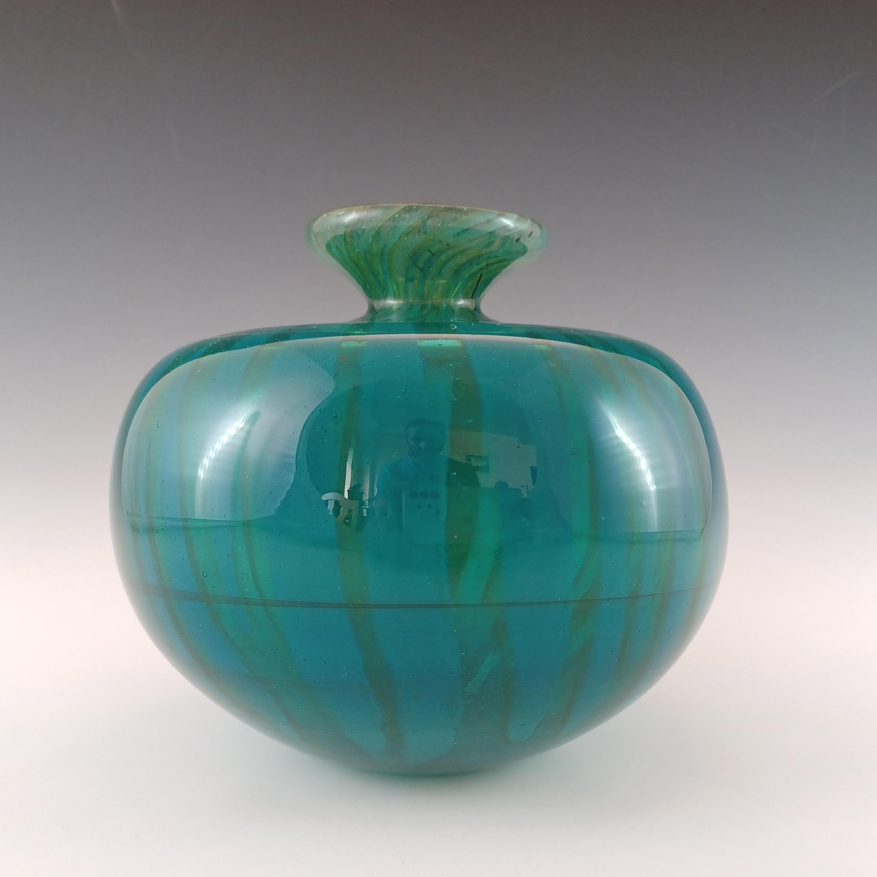 A wonderful large and heavy (2.1kg unpacked) Maltese glass 'globe' vase in a striped variation of the Ming pattern. Made at Mdina Glass by Eric Dobson, fully signed with artist signature and dated 1975 to the base. Although the vase looks green, the