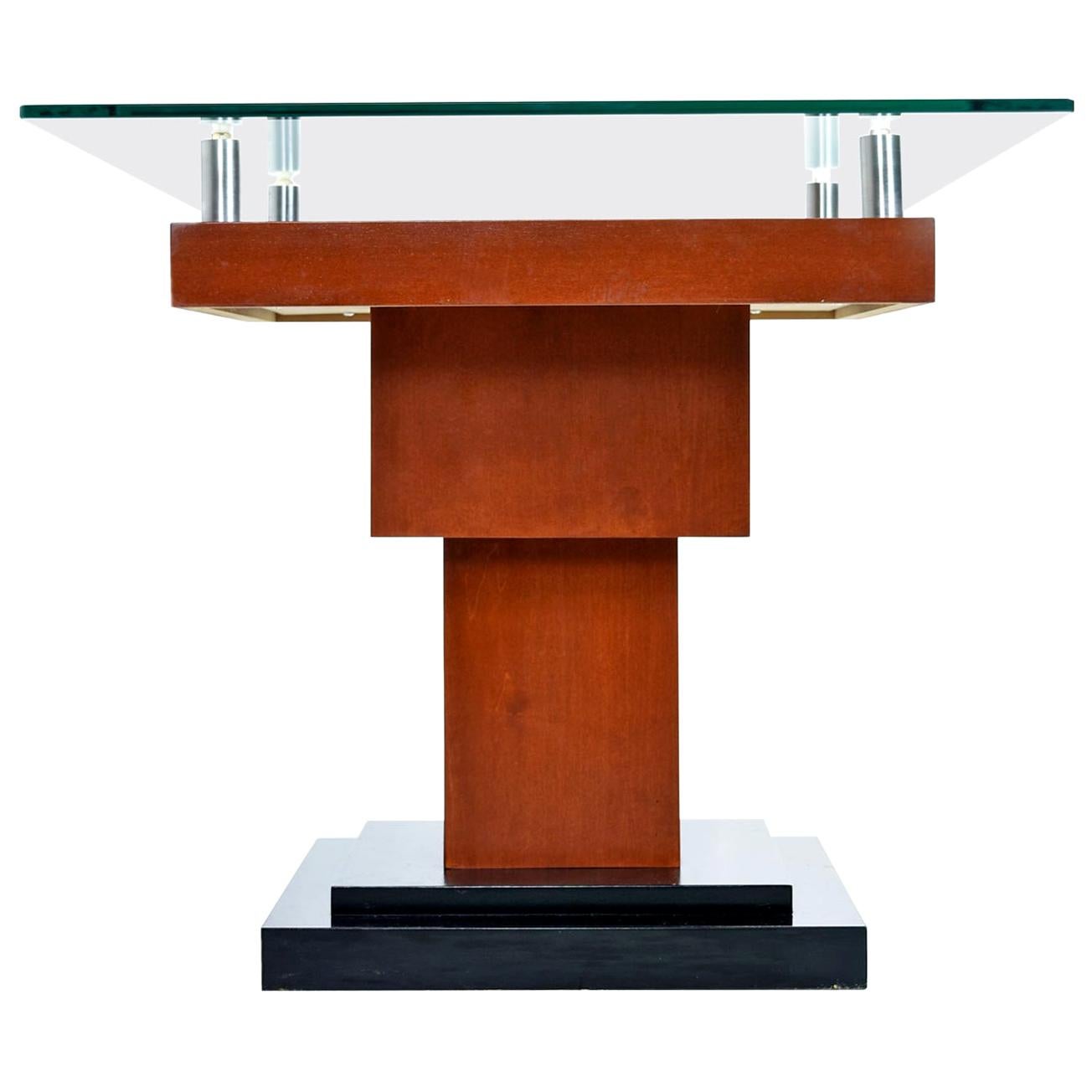 This glass-topped wood inlay side table is packed with personality! Outstanding design and construction is exhibited throughout the monumental form. The modern wood inlay design is a work of art. The bold contemporary marquetry employs various tones