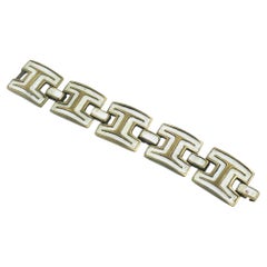 Bracelet de l'artiste St Luc du milieu du siècle dernier en bronze doré et émail blanc