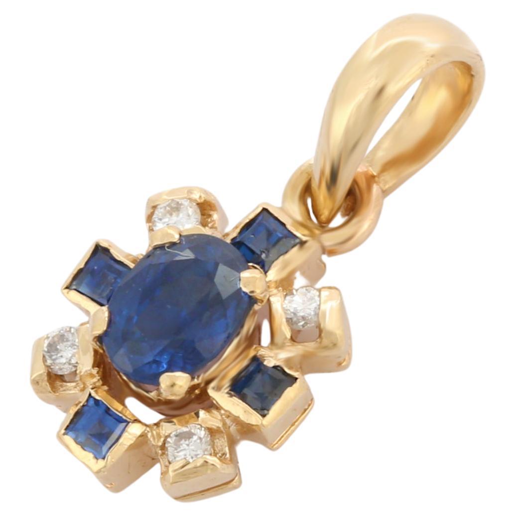 Artist Style Blue Sapphire Floral Pendant in 14K Yellow Gold with Diamonds For Sale