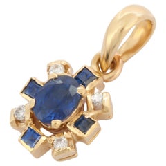 Blauer Saphir-Blumenanhänger im Künstlerstil aus 14 Karat Gelbgold mit Diamanten