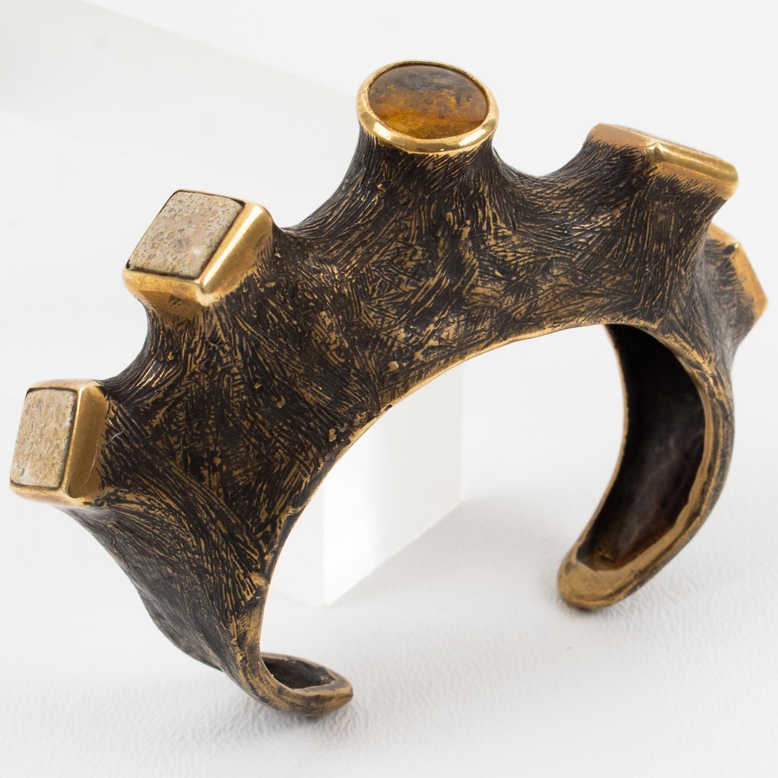 This stunning sculptural brutalist bronze cuff bracelet was hand-crafted by a French artist in the 1980s. This is a one-of-a-kind piece with organic inspiration. The bangle features a carved and textured tree branch with an original brown patina,