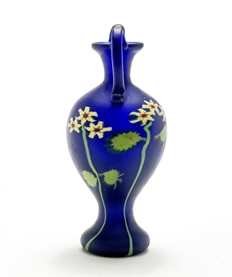 Artisti Barovier Murrine Cobalt Blue Floreali Vase with Handles, Italy, c. 1914. internally decorated glass with murrines and polychrome threads
Height: 5.75 inches. 
Artisti Barovier was founded in 1884 using the former furnaces of Salviati,