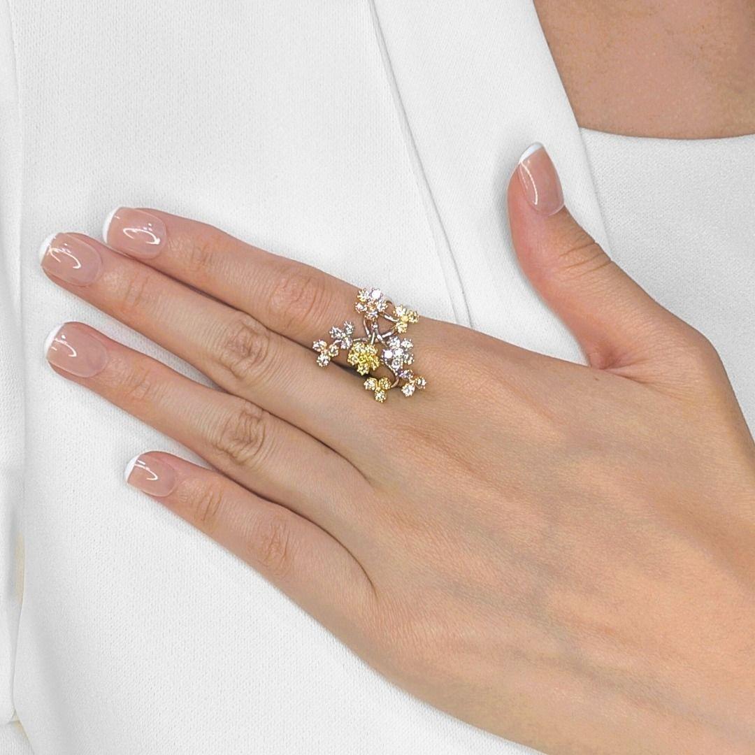 Celebrate nature's artistry with this breathtaking floral-inspired ring, masterfully crafted from a harmonious blend of 18K tri-color gold. Intricate branches, rendered in the distinct, warm and cool hues of the tri-color gold, gracefully intertwine