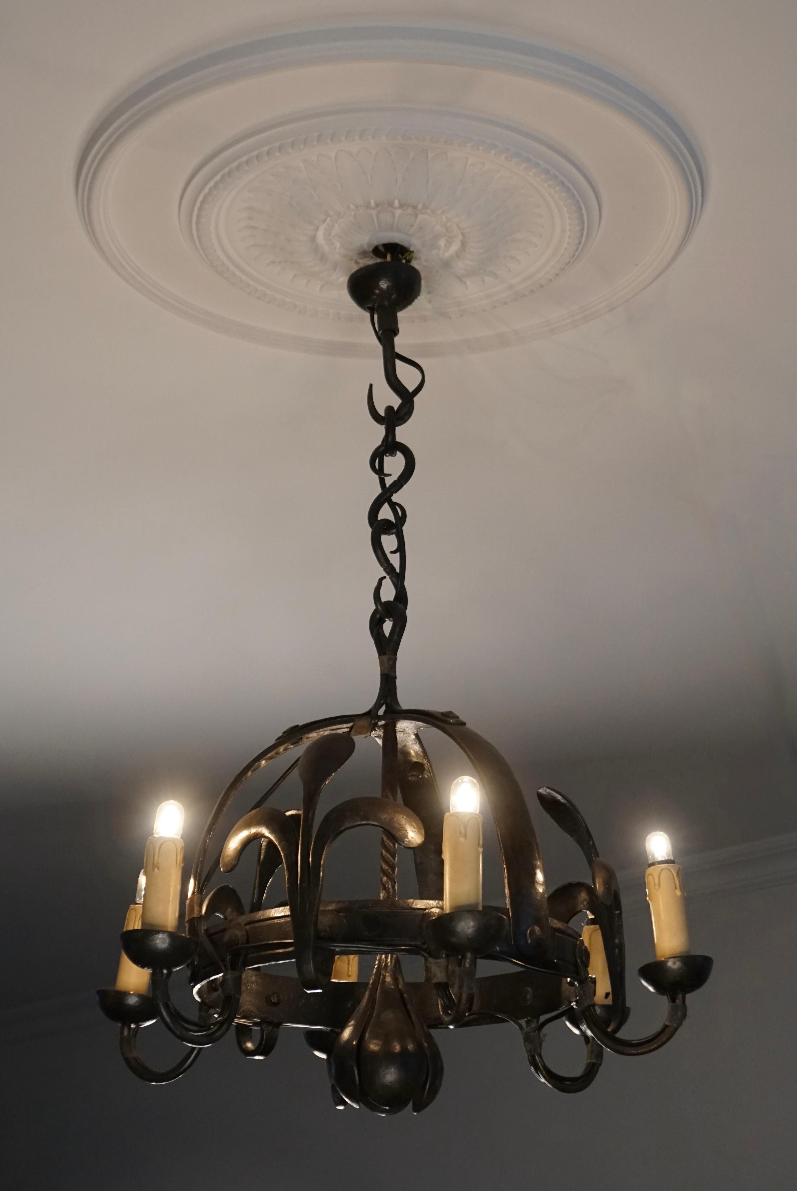 Original antique candle pendant converted to electric chandelier.

This unique and elegant, six-light chandelier incorporates everything that we love about antiques: it is unique, it is all handcrafted, it is of excellent quality workmanship, it is