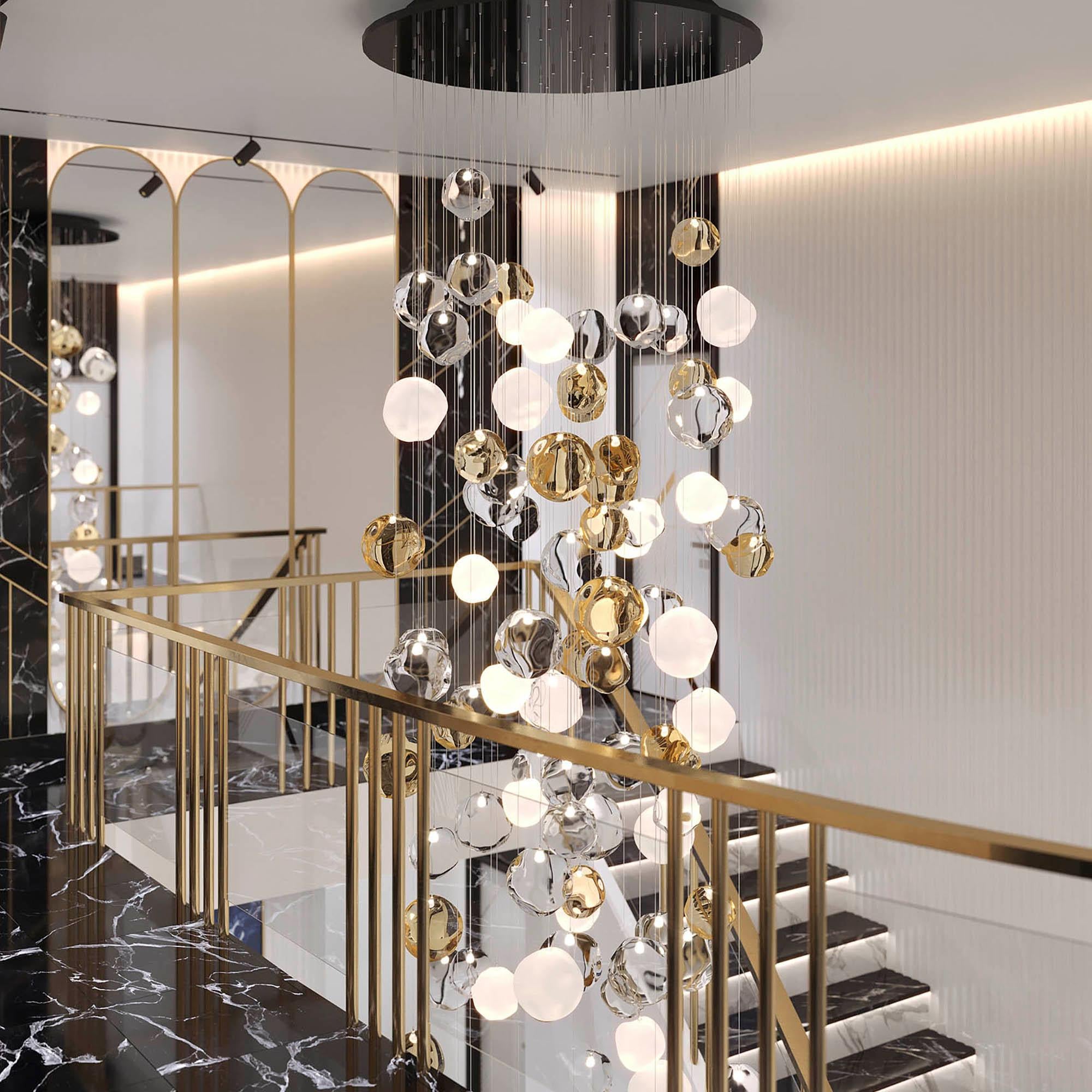 Elegant and unmistakable, suggestive and poetical, soft and delicate are some of the adjectives that can be used to describe the blown glass ball chandelier Desafinado, our ceiling light with hand-blown glass spheres.

This item consists in a new