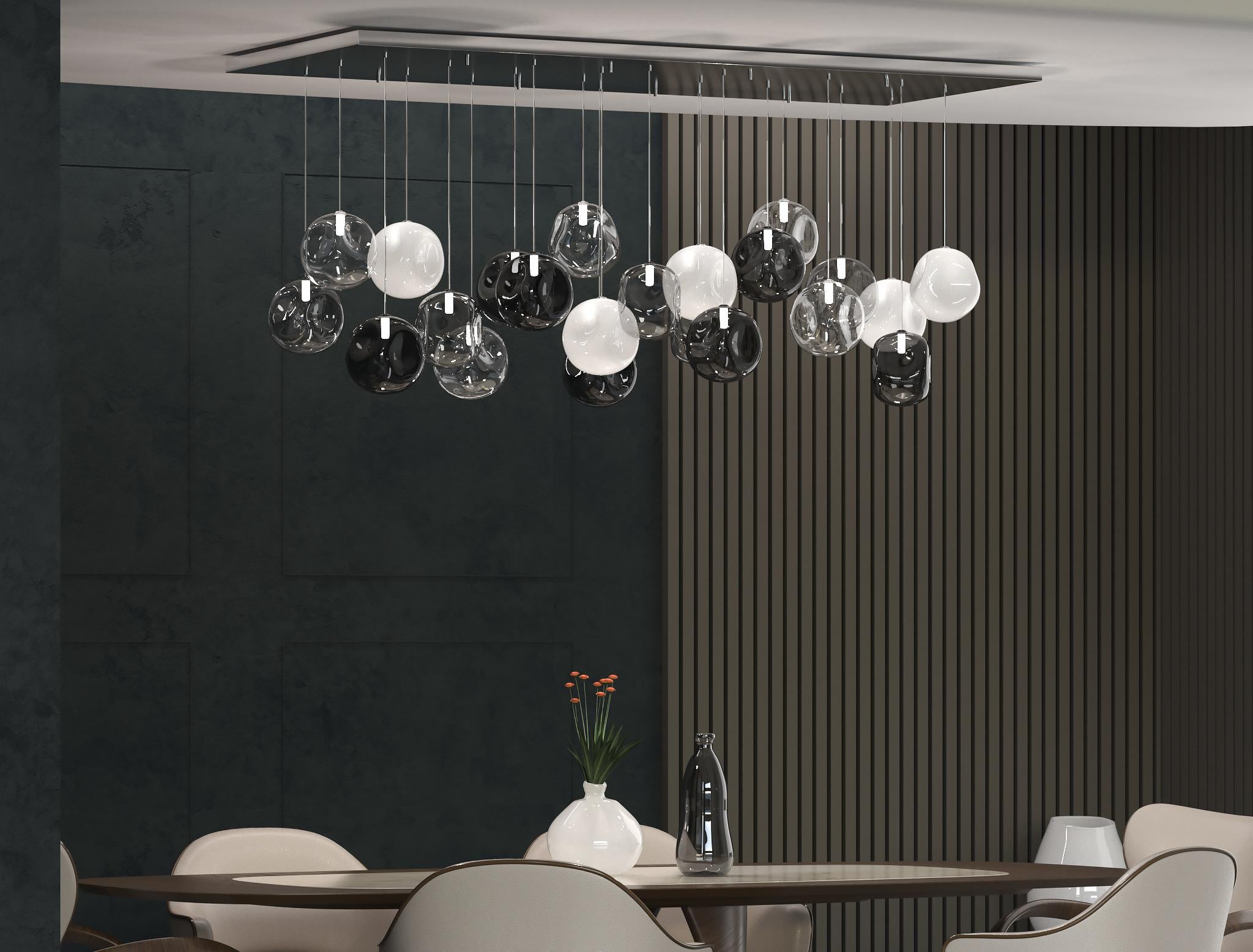 Artistic ceiling lamp, glass spheres in clear, satined, mirrored and pulegoso size 65x160cm.
Elegant and unmistakable, suggestive and poetical, soft and delicate are some of the adjectives that can be used to describe the blown glass ball