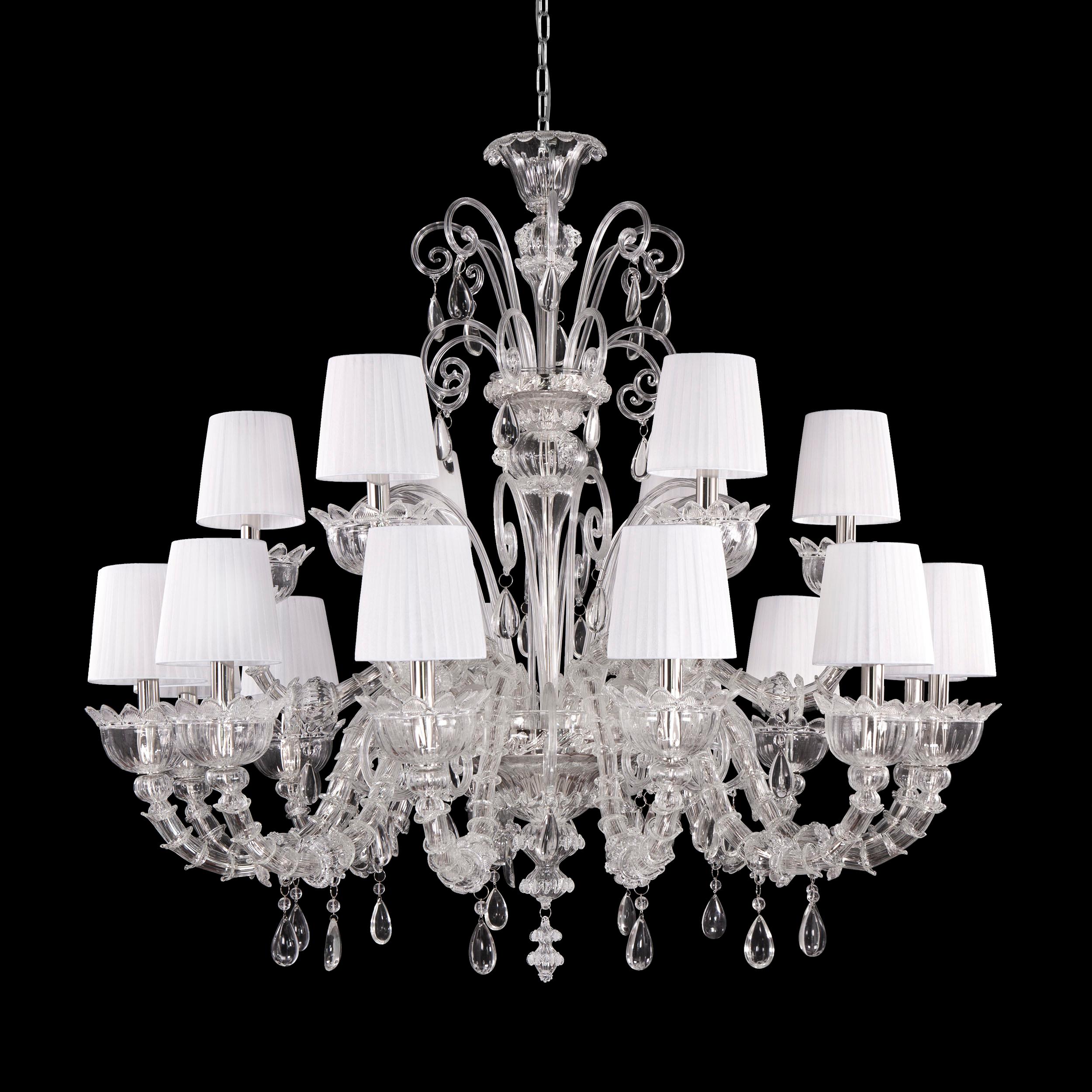 Montecristo chandelier 18 arms, artistic clear glass, white organza lampshades by Multiforme.
Montecristo collection is created with the typical elements of Venetian glass chandeliers. From the central column, decorated with “morrise” and roses,