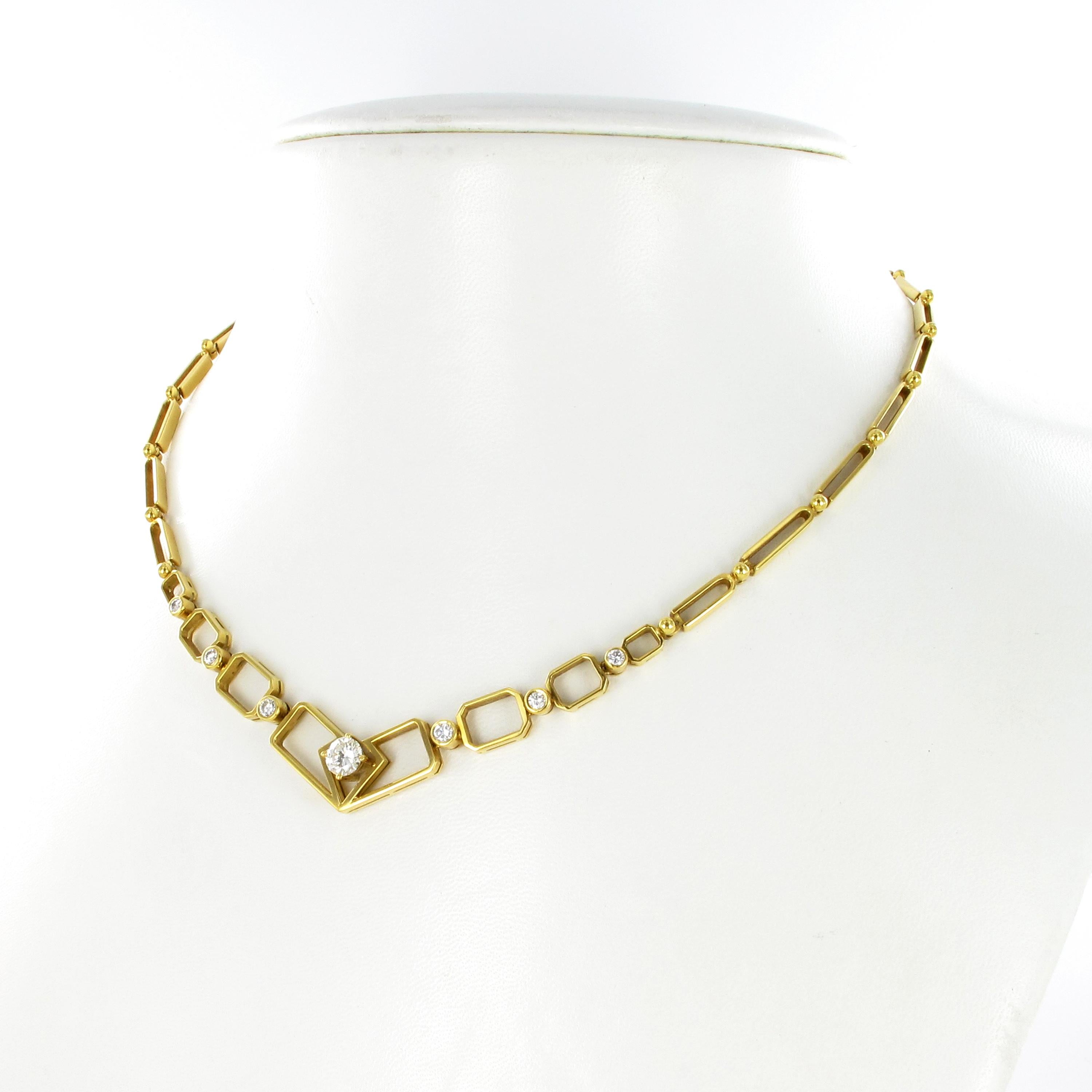 Unique necklace with an artistic touch handcrafted in 18 karat yellow gold. 

A combination of open worked, octagonal- and long clamp shaped links are connected by small gold spheres. Six links are bezel set with brilliant-cut diamonds totalling