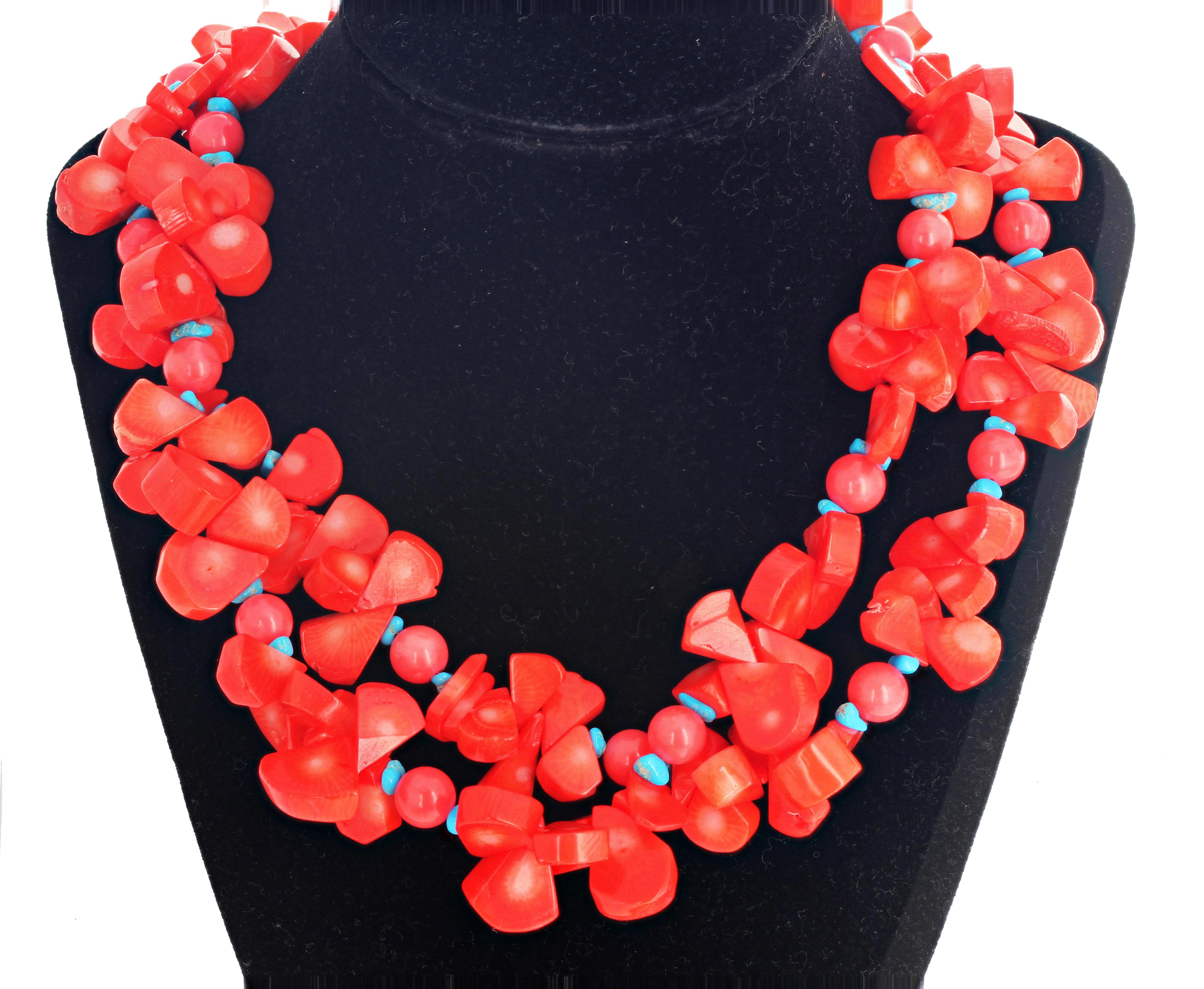 Unique double strand of unique polished petals and polished round natural Orange Coral accented with blue Turquoise rondels in this 18 inch long necklace with easy to use goldy tone hook clasp.  The largest Turquoise petals are approximately 16 mm x