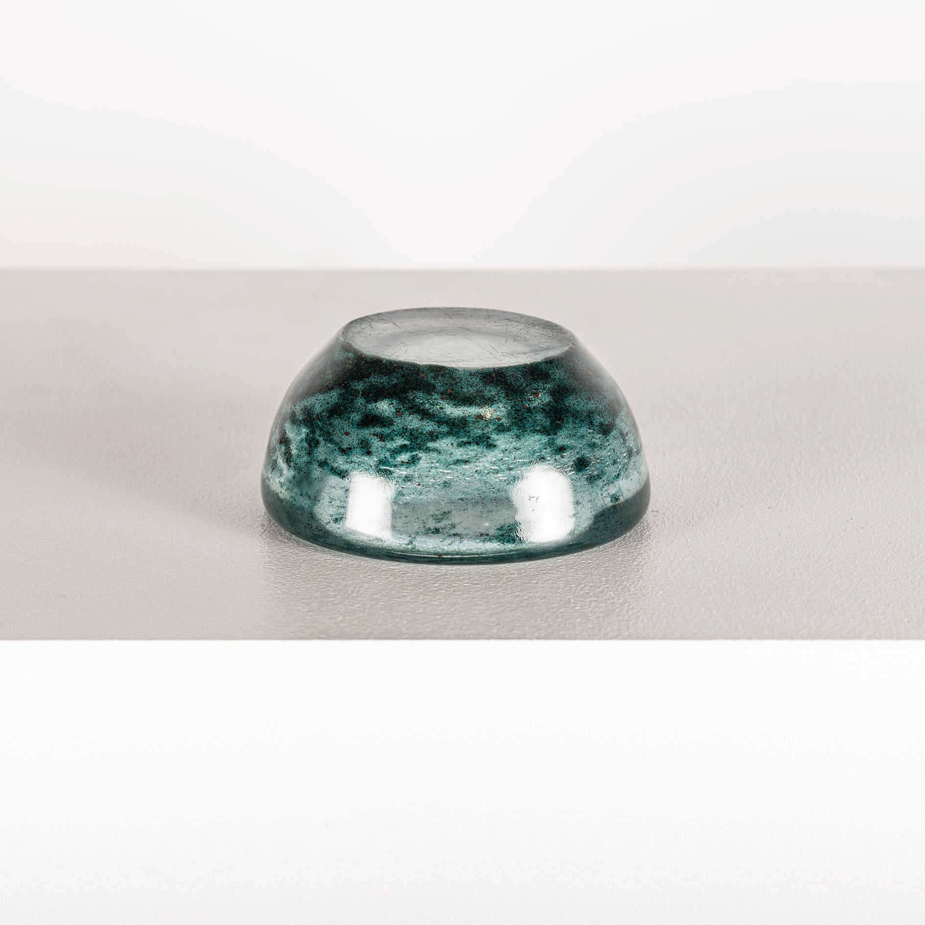 The Artistic Enameled Glass Bowl from Daum, crafted in the 1950s, is a captivating example of mid-century artistry and craftsmanship. Daum, a prestigious French glassmaking company renowned for its exquisite creations, combines tradition and