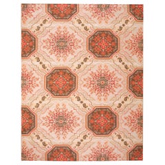 Tapis contemporain tissé à l
aiguille à motifs floraux et médaillons Artistics