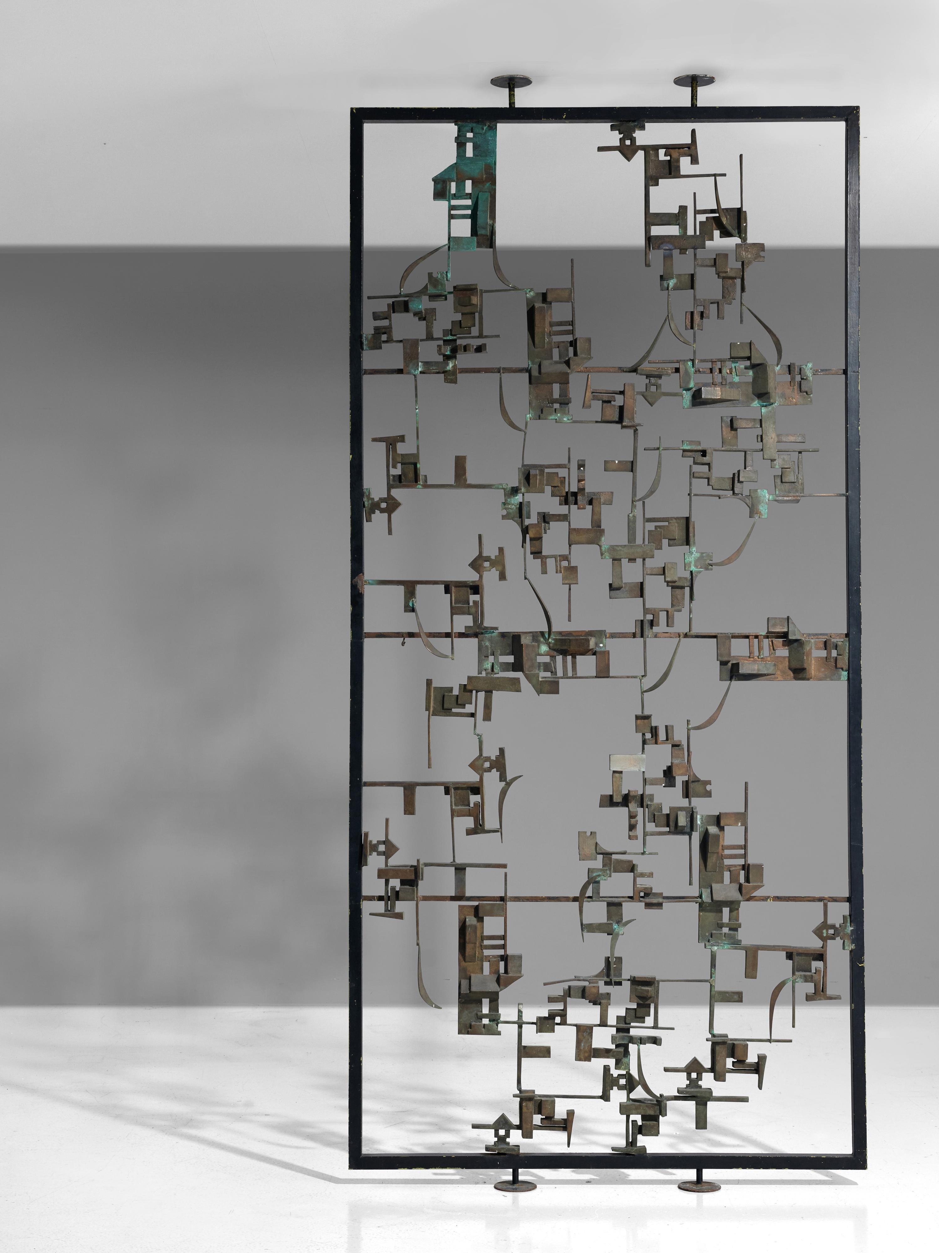 Hand-crafted room divider, bronze, metal, Italy, 1960s.

An Italian Postwar room screen that finds itself at the intersection of art and design. This highly sculptural piece consists of an abstract structure in bronze with abstract shapes and