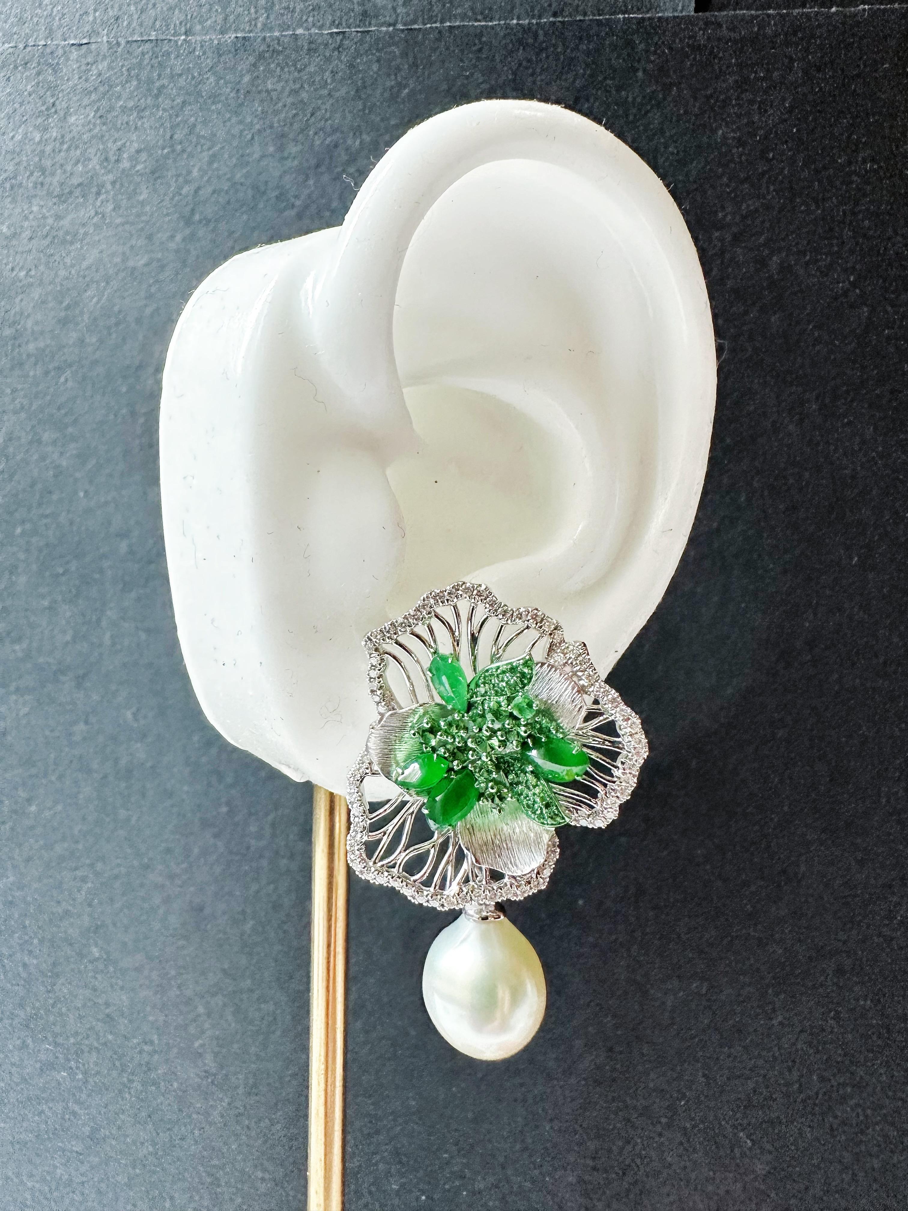 Step into elegance with these artistic imperial green jade irregular shape cabochon earrings, expertly set in 18K gold. The lush green jade is intricately carved to resemble flower petals, creating a stunning 3D effect that captures the