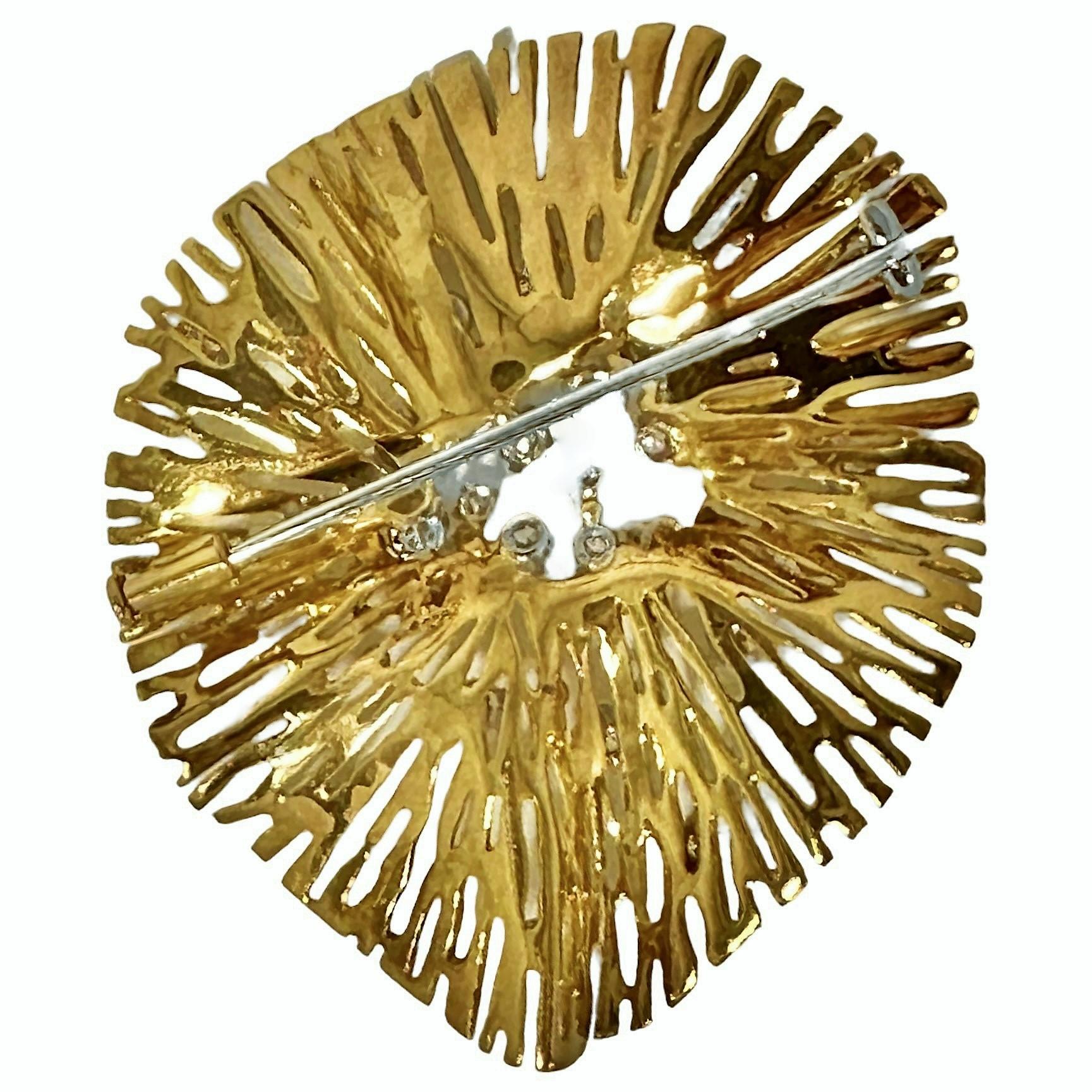 This large scale, Italian, 18k yellow gold Modernist brooch is set with 23 brilliant cut diamonds that are artistically interspersed throughout the piece. This dramatic jewel represents the epitome of this genre.  The entire gold portion of the