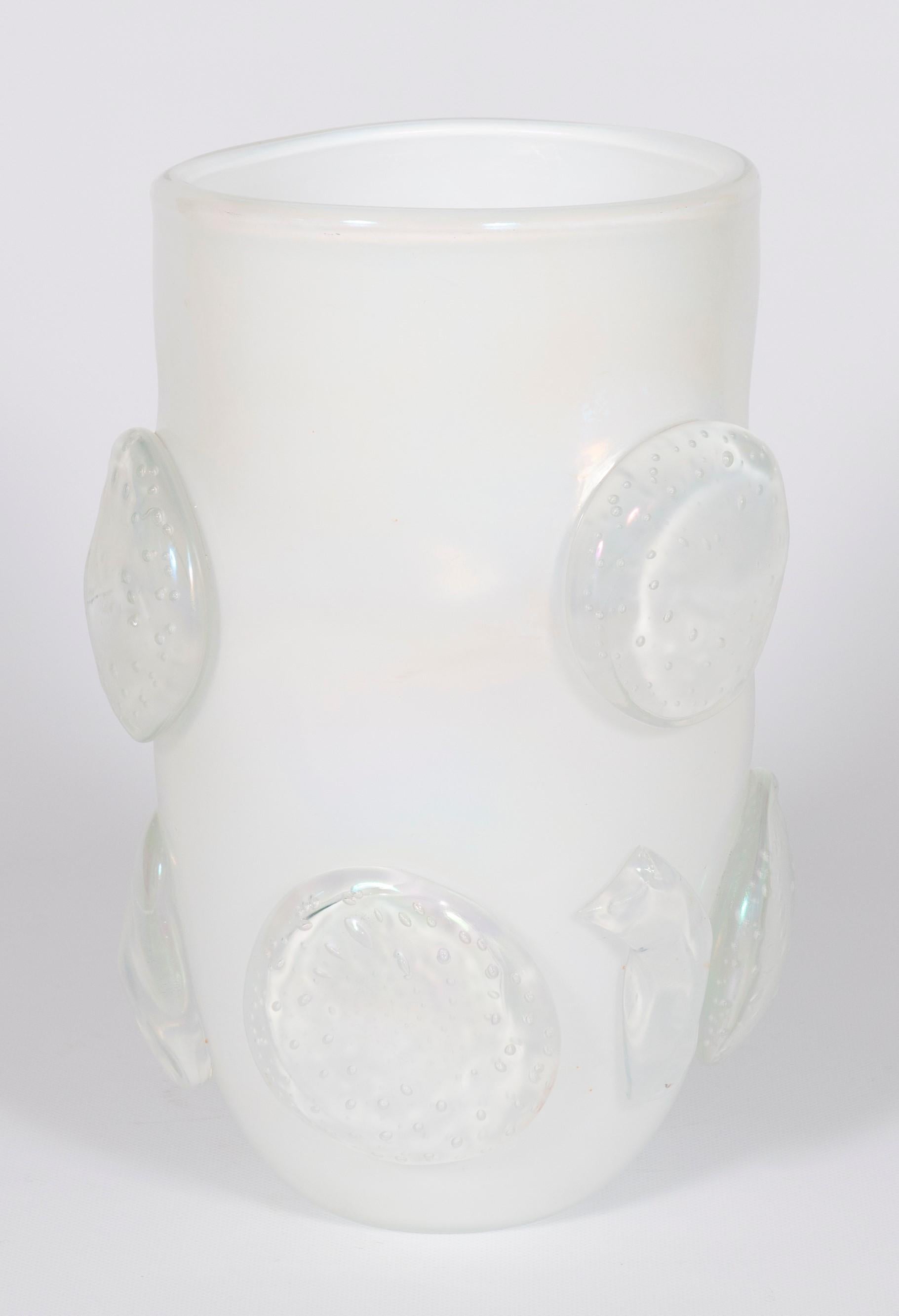 Artistic milk-white and iridescent vase with Murano glass and paste, by Romano Donà, Italy, 1990s.
This artistic vase, entirely made with blown Murano glass in the 1990s, has a unique and abstract design: the artist was able to skillfully add a