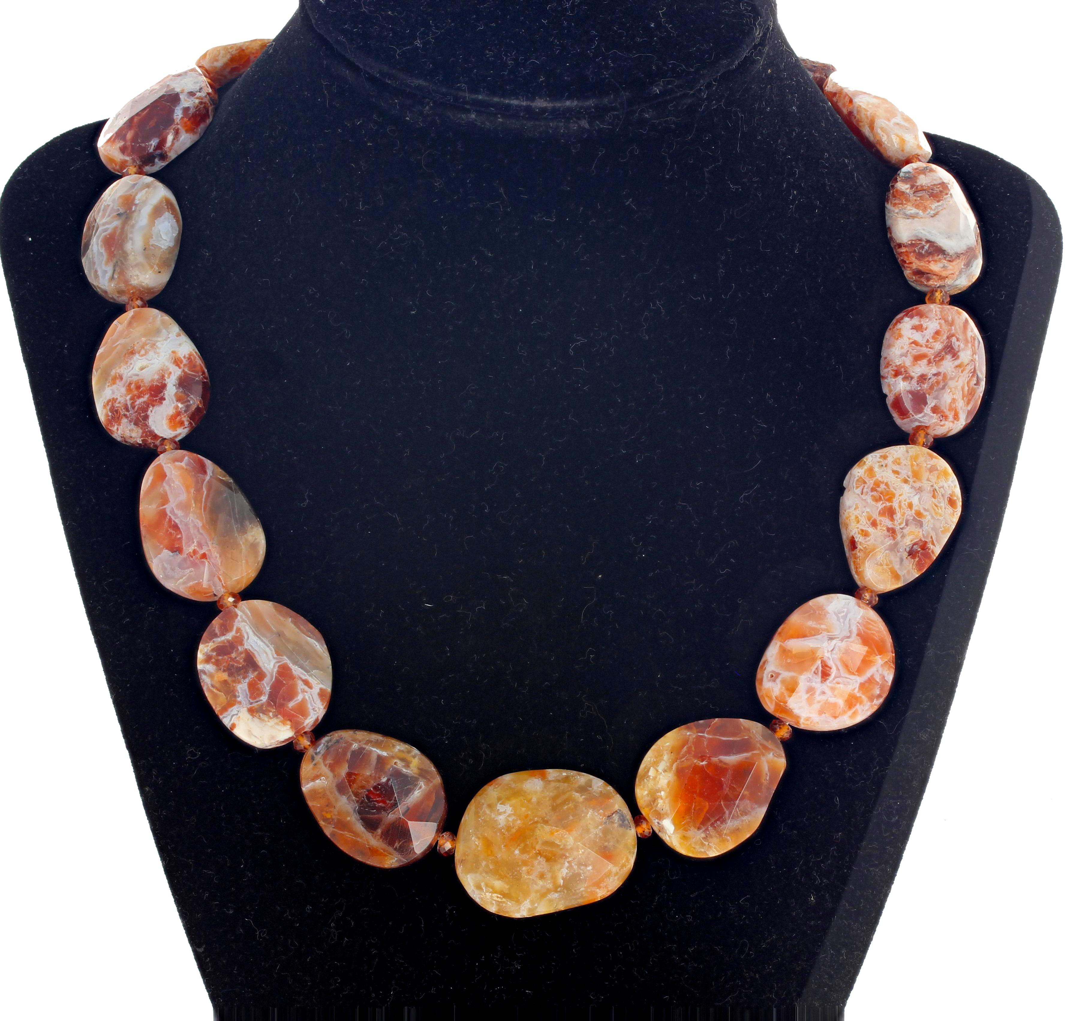 Multi color artistic rare natural Brandy Opal accented with gem cut glittering little Hessonite Garnets in this 18.5 inch long necklace with gold tone easy to use hook clasp. I wear one of these to dinner in the evenings and people come up and ask