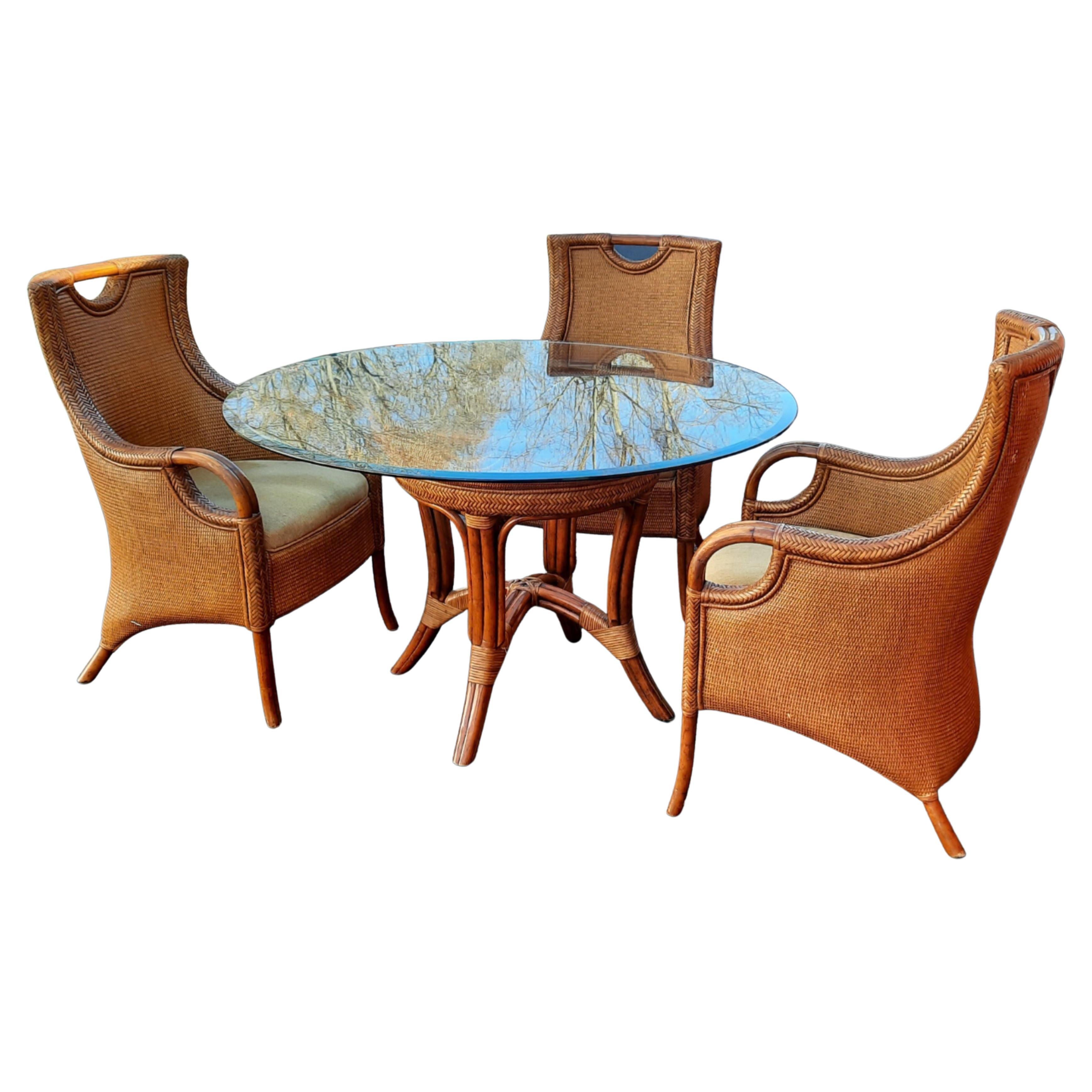Beautiful dining set designed and crafted by Artistica Home. Designed in the United and hand crafted, hand Woven in the Philippines by the finest Pilipino rattan and wicker artisans. Custom Basket double sided wicker woven pedestal table with thick