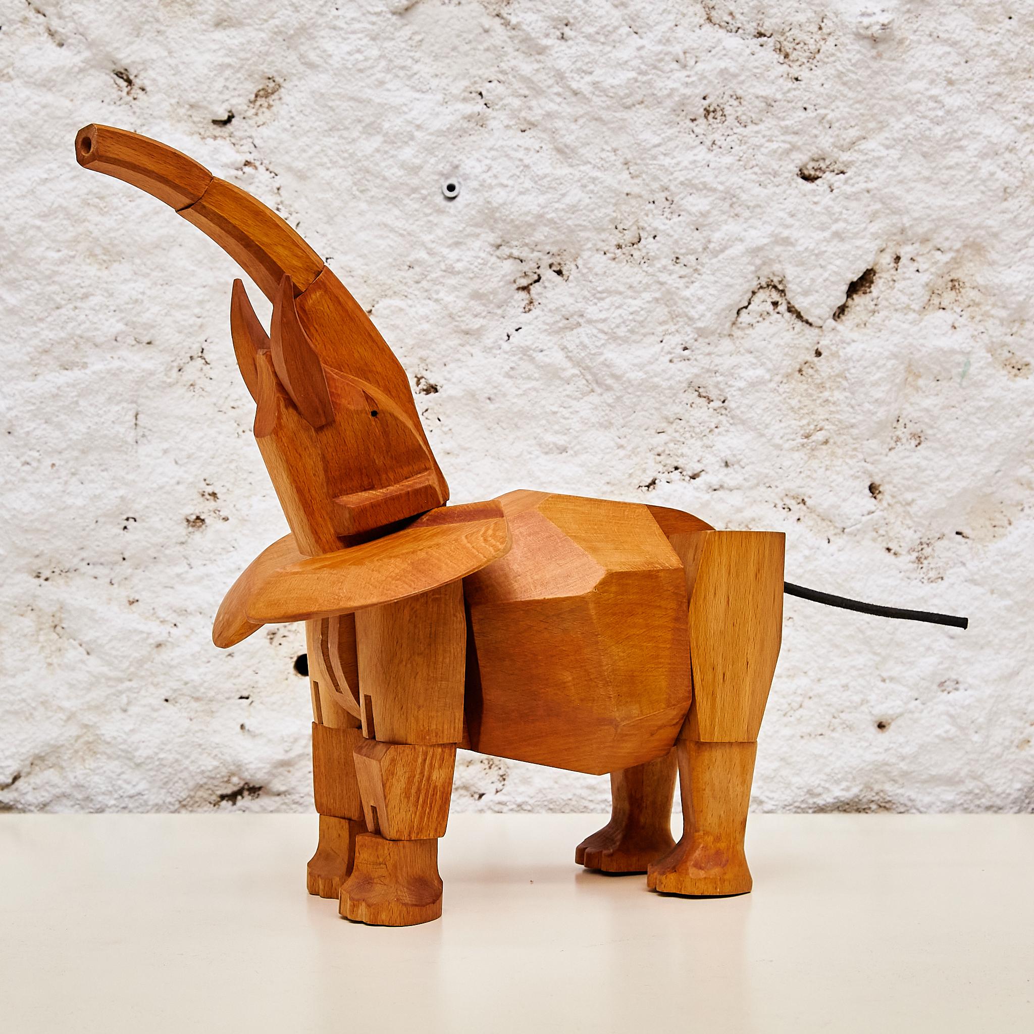 Step into the realm of artistry with the remarkable solid wood elephant sculpture 
