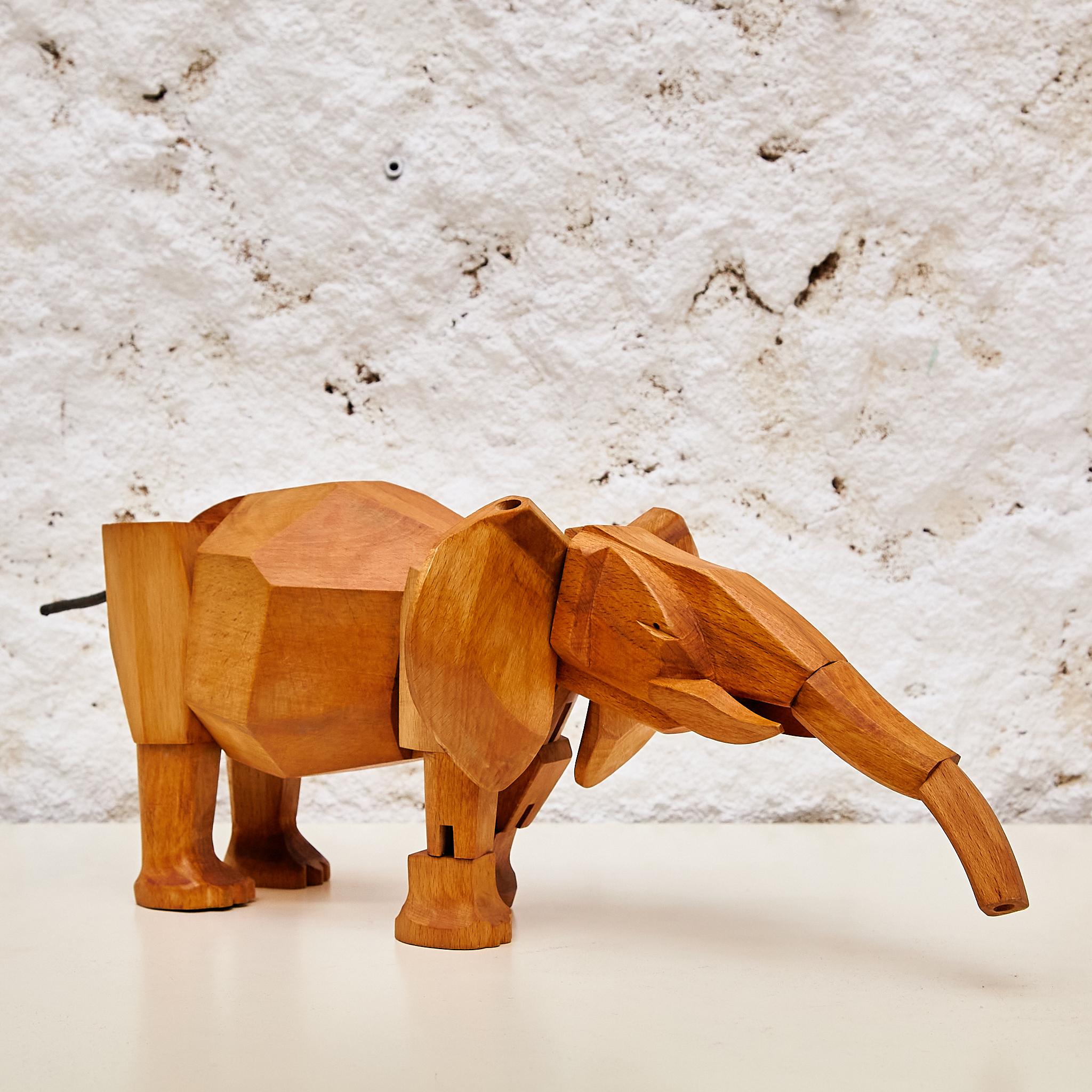 Artistry in Wood: 'Areaware' Solid Wood Elephant Sculpture by David Weeks Studio 1