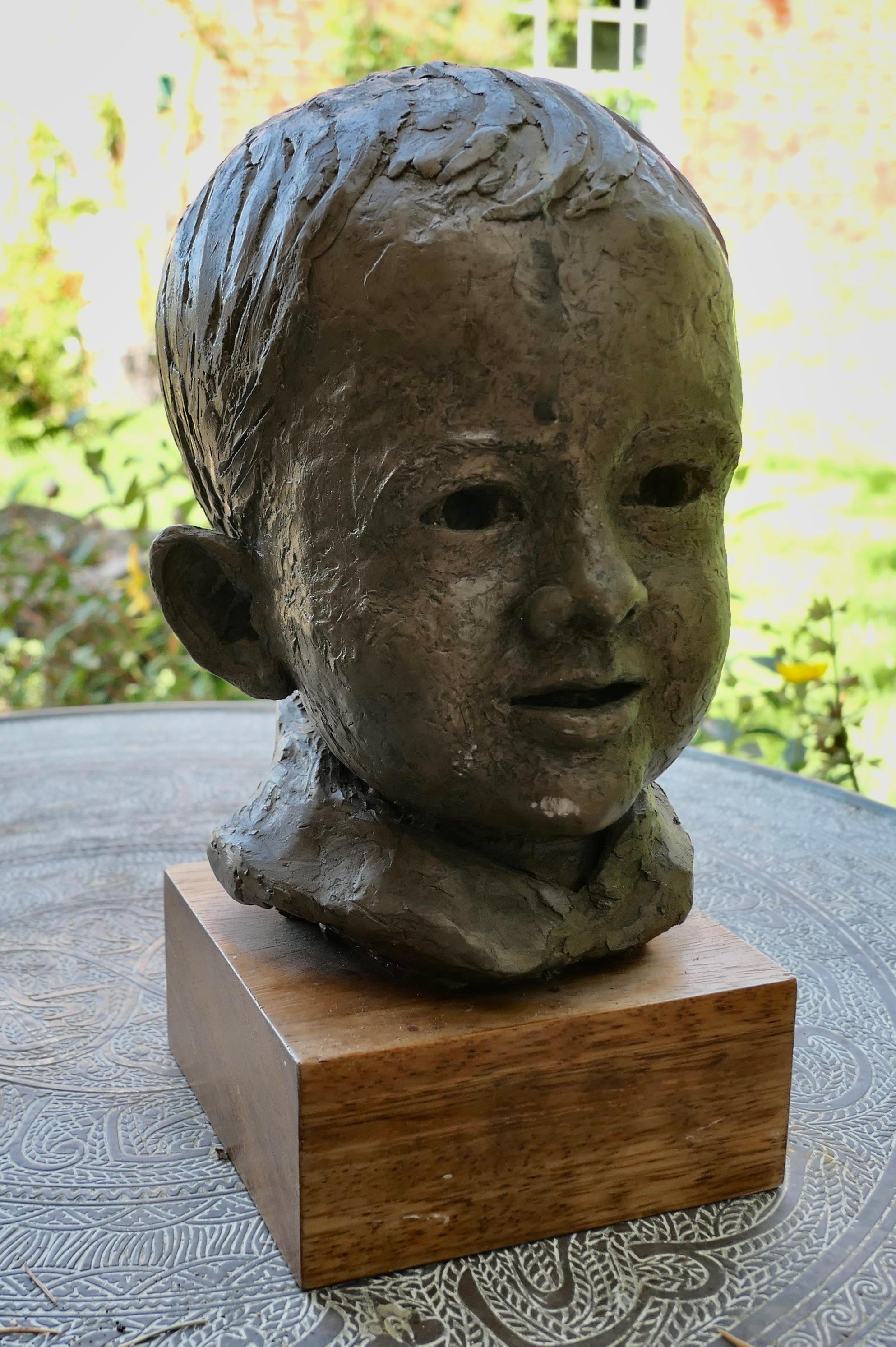 Folk Art Artist’s Model Bust of a Very Young Smiling Boy, signed and dated    For Sale