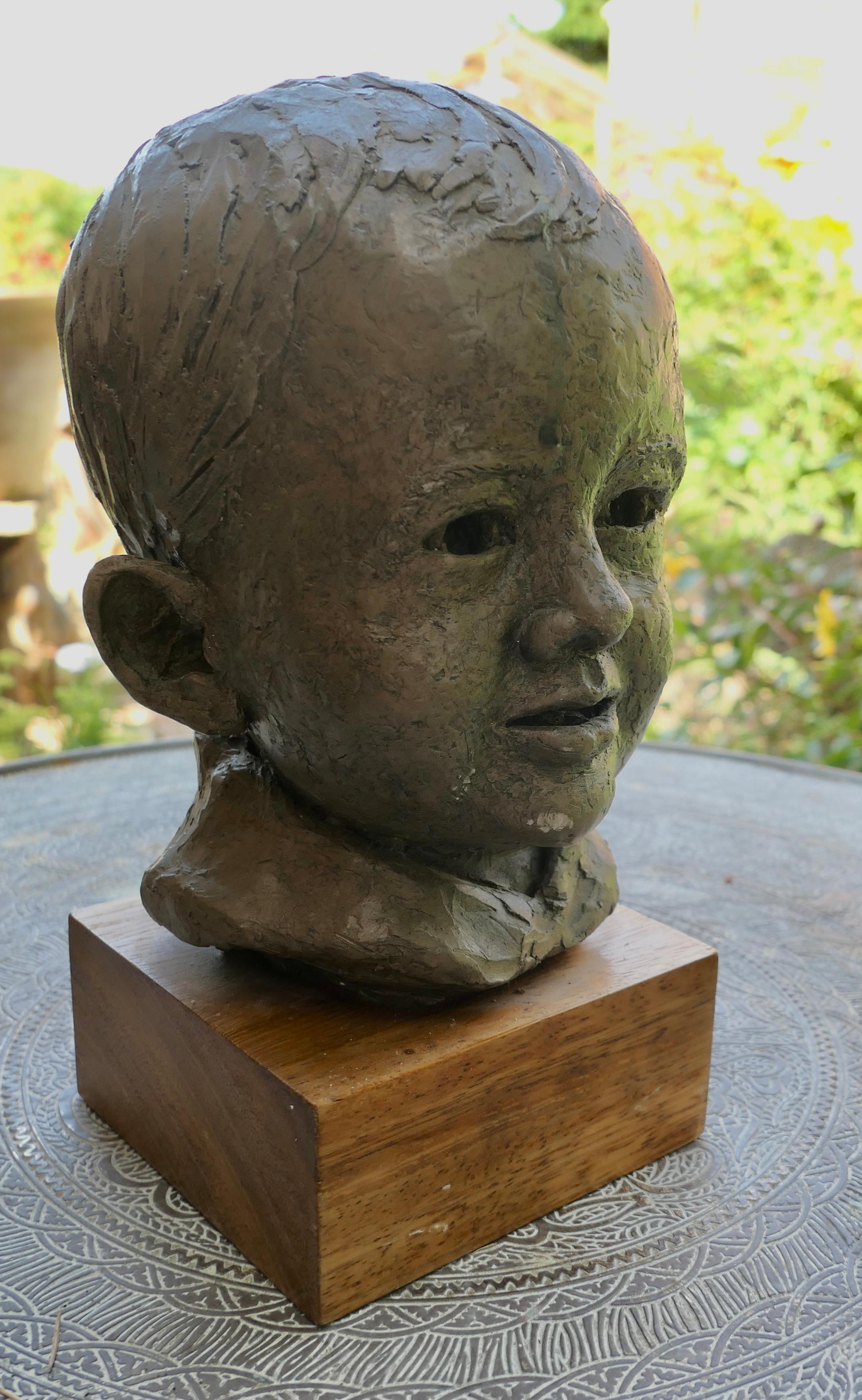 Clay Artist’s Model Bust of a Very Young Smiling Boy, signed and dated    For Sale