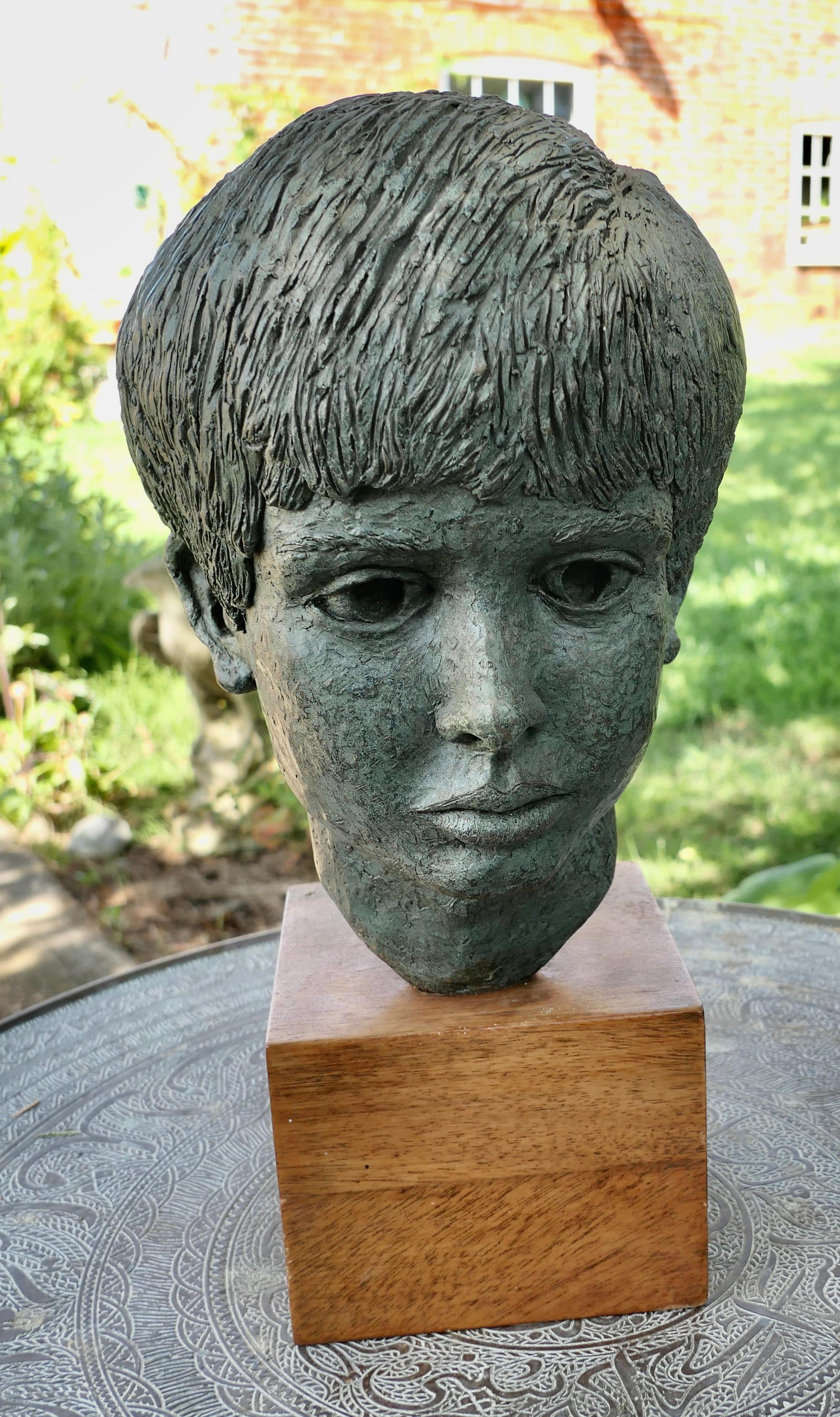 Artist’s Model Bust of a Young Boy, not signed

This is a very attractive hand made piece dating from the middle of the 20th Century, it was discovered in an Art Studio during refurbishment 

It is a three dimensional head made in clay with a bronze