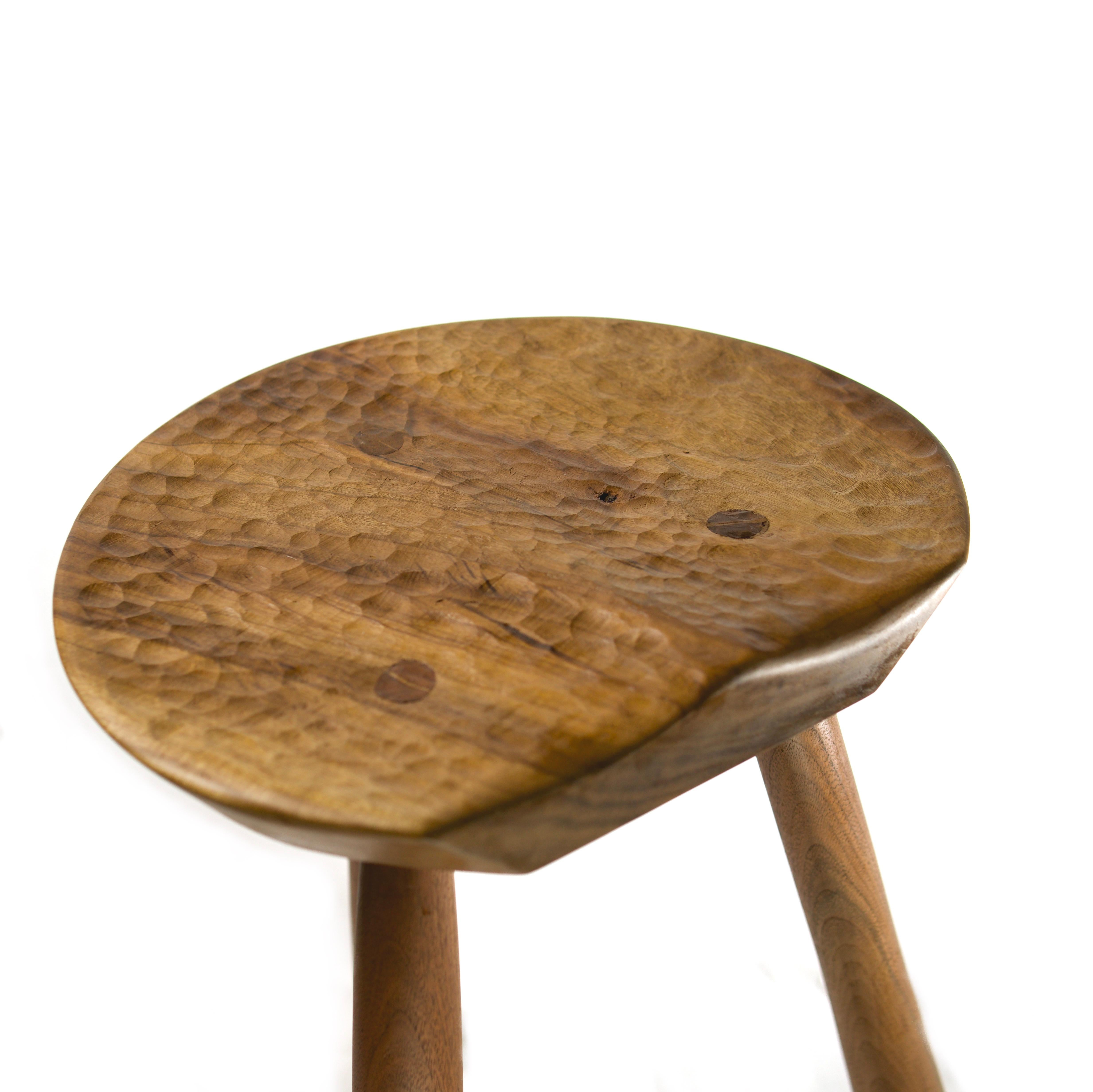 Designed & made of the finest craft by Andrew Brant of Santa Fe, New Mexico, this three legged stool is hand carved to be organic, warm, and inviting in the modern home. 

Inspired a traumatic year of love and loss, this stool was designed in the