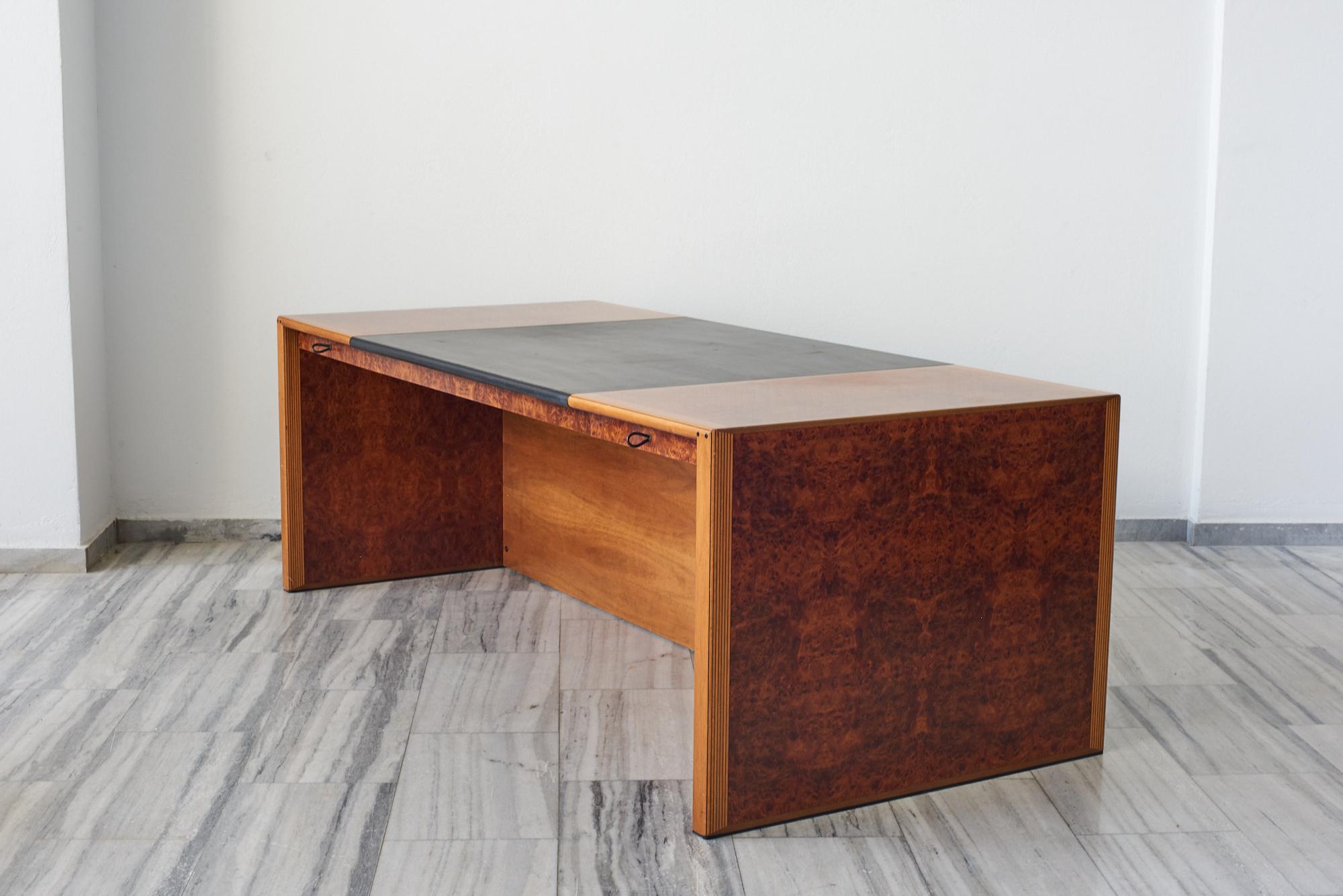 The Artona executive desk by Afra and Tobia Scarpa  was the first line ever produced by Maxalto.
Maxalto was set up in 1975 as a high-end division of B&B Italia to focus exclusively on the production of artisanal, mostly wood furniture. 
The desk